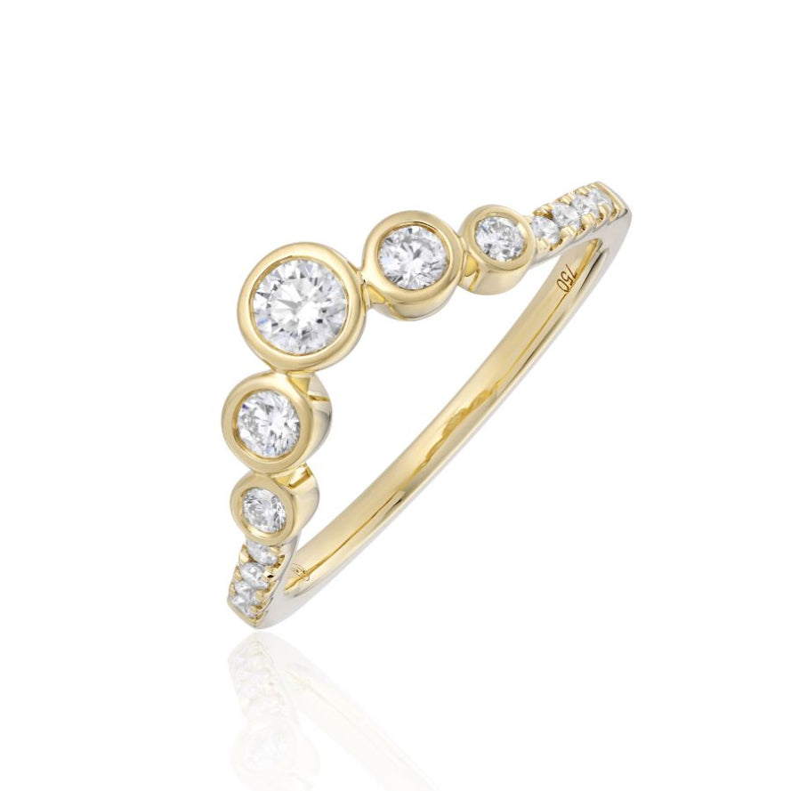 Gold ring with diamond stones on a white background