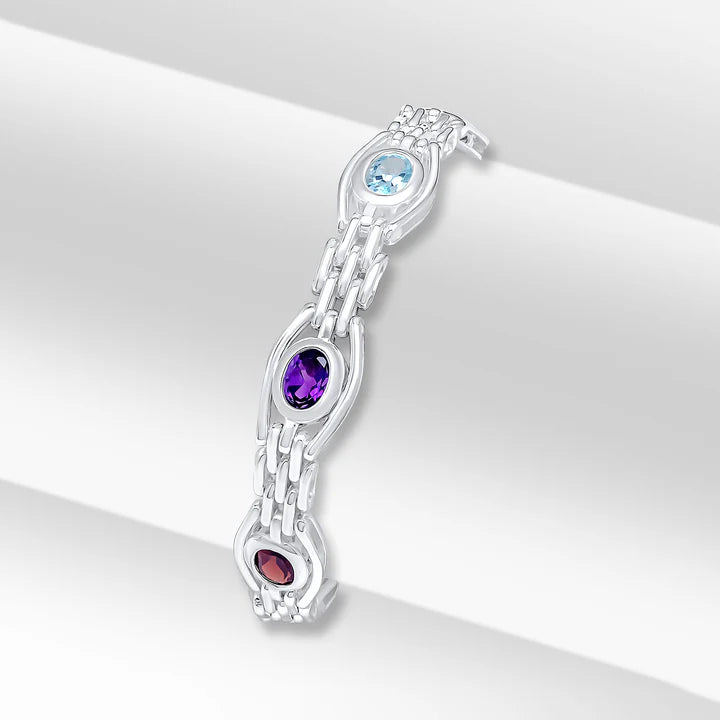Herbert silver gate bracelet featuring mixed gemstones on a 7.5-inch chain, showcasing colorful stone accents and intricate metal links.