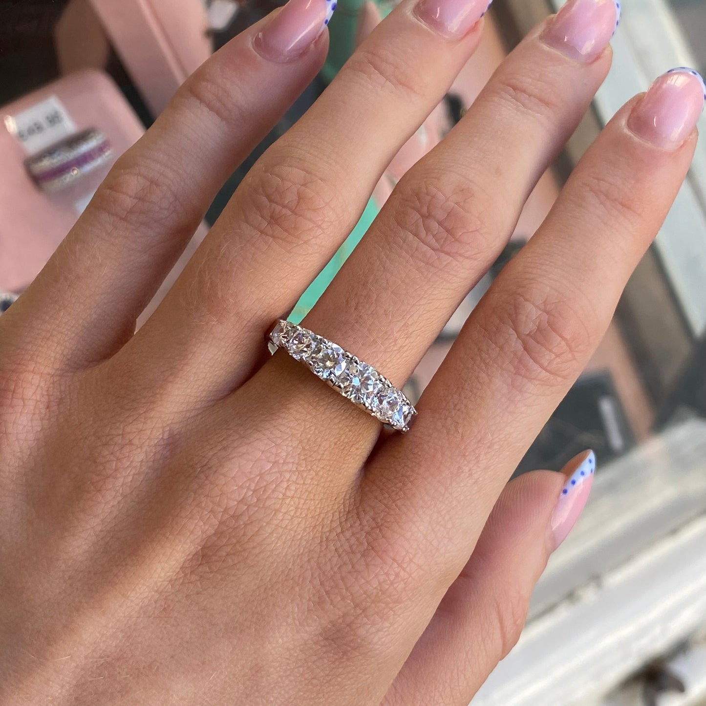 Silver Samantha ring by Comero featuring a sleek band and elegant design, displayed on a neutral background.