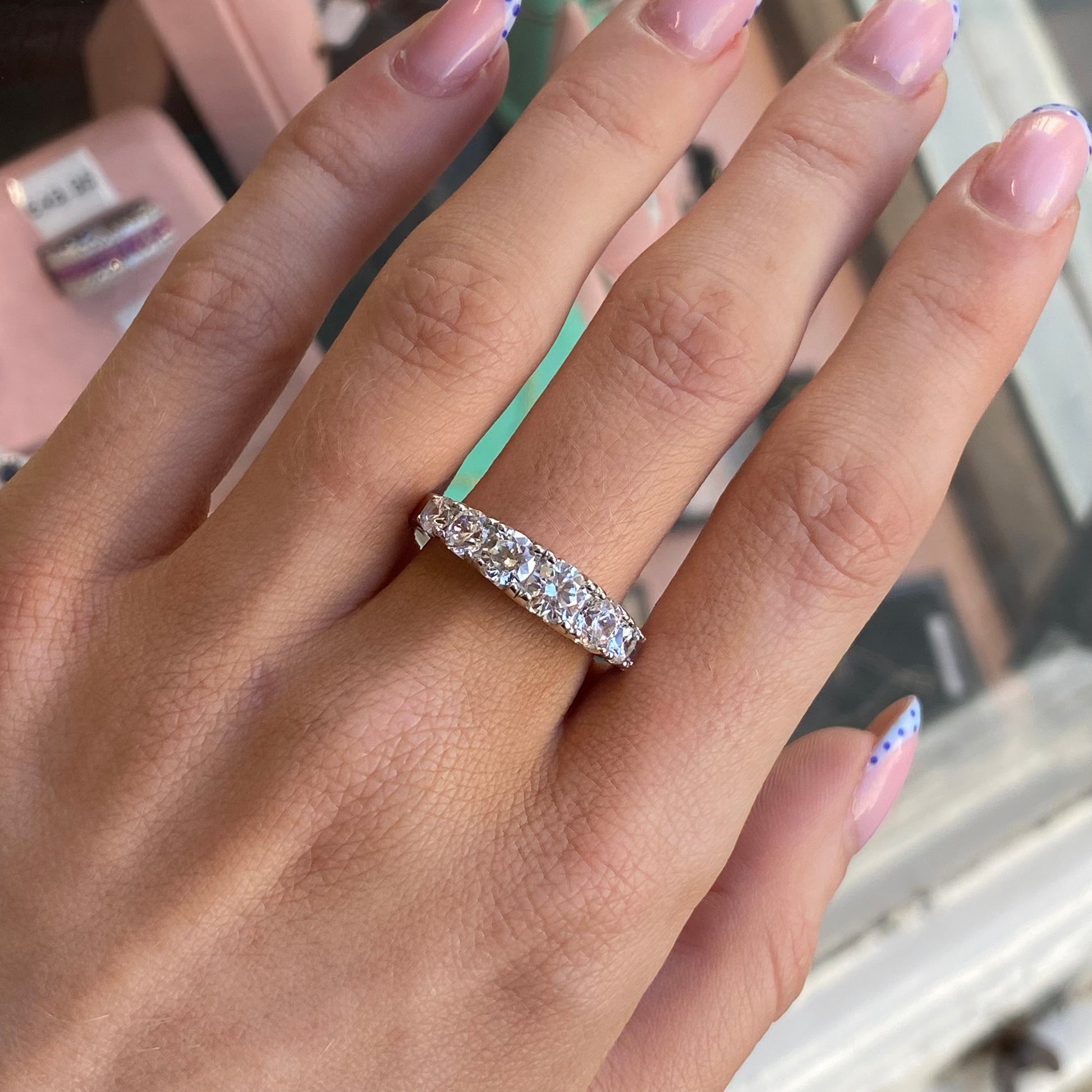 Silver Samantha ring by Comero featuring a sleek band and elegant design, displayed on a neutral background.