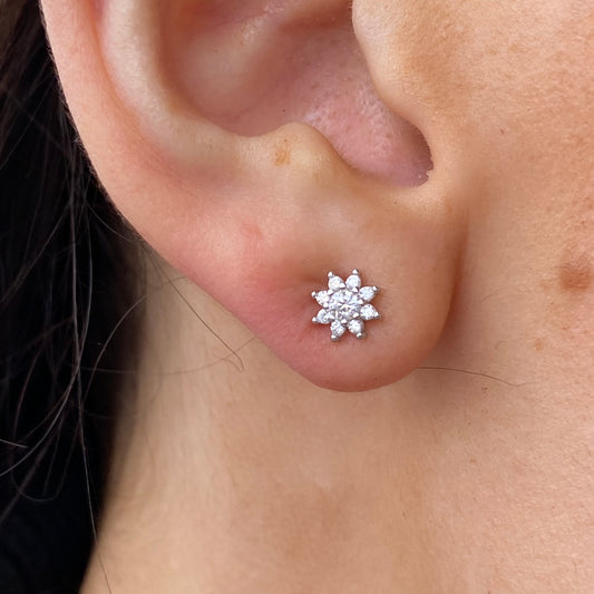 Silver Star CZ stud earrings by Comero featuring sparkling cubic zirconia gemstones set in silver.