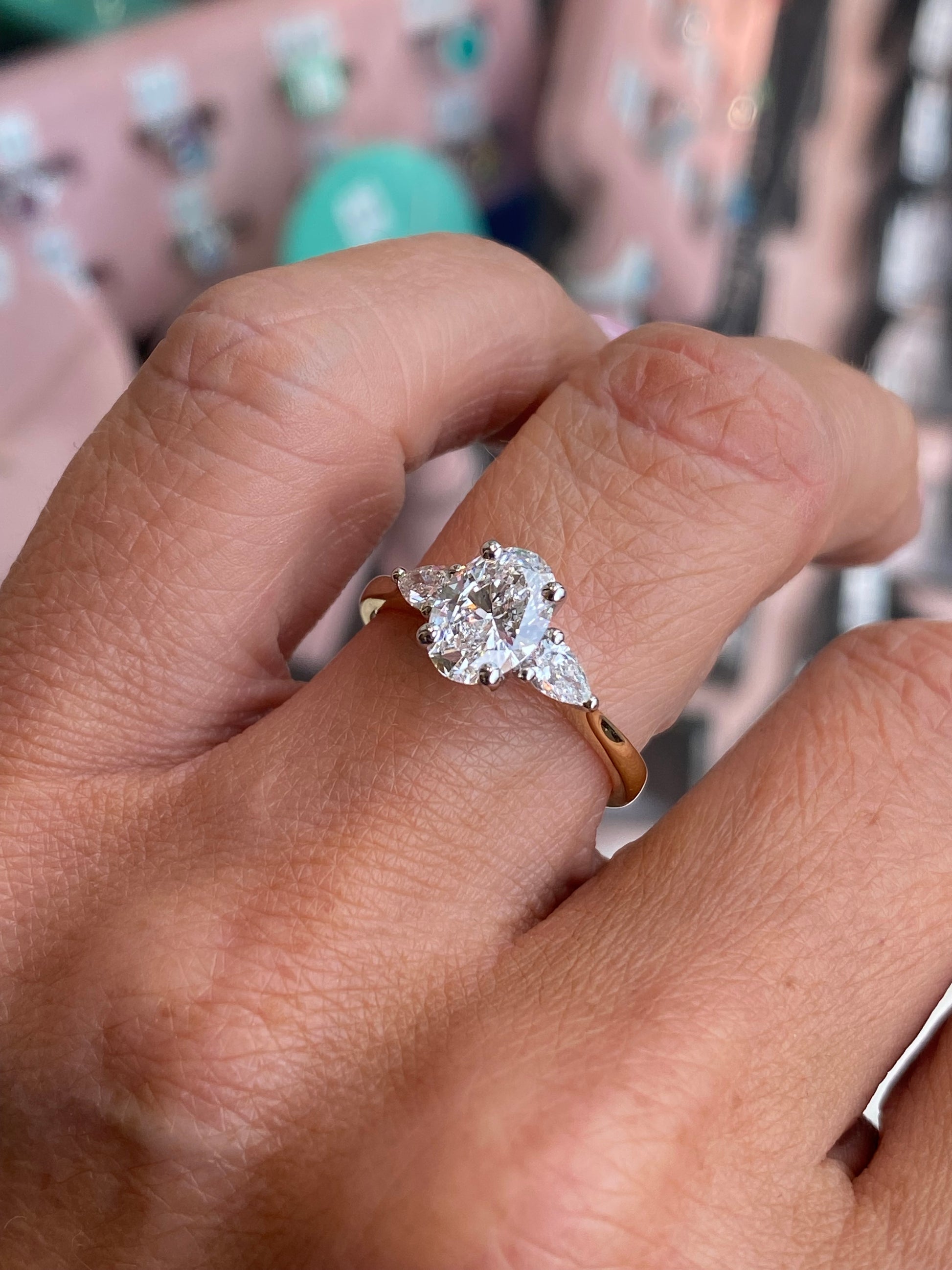 Prima 18ct gold trilogy engagement ring with three central diamonds, showcasing a certificated lab 1.61ct stone design.