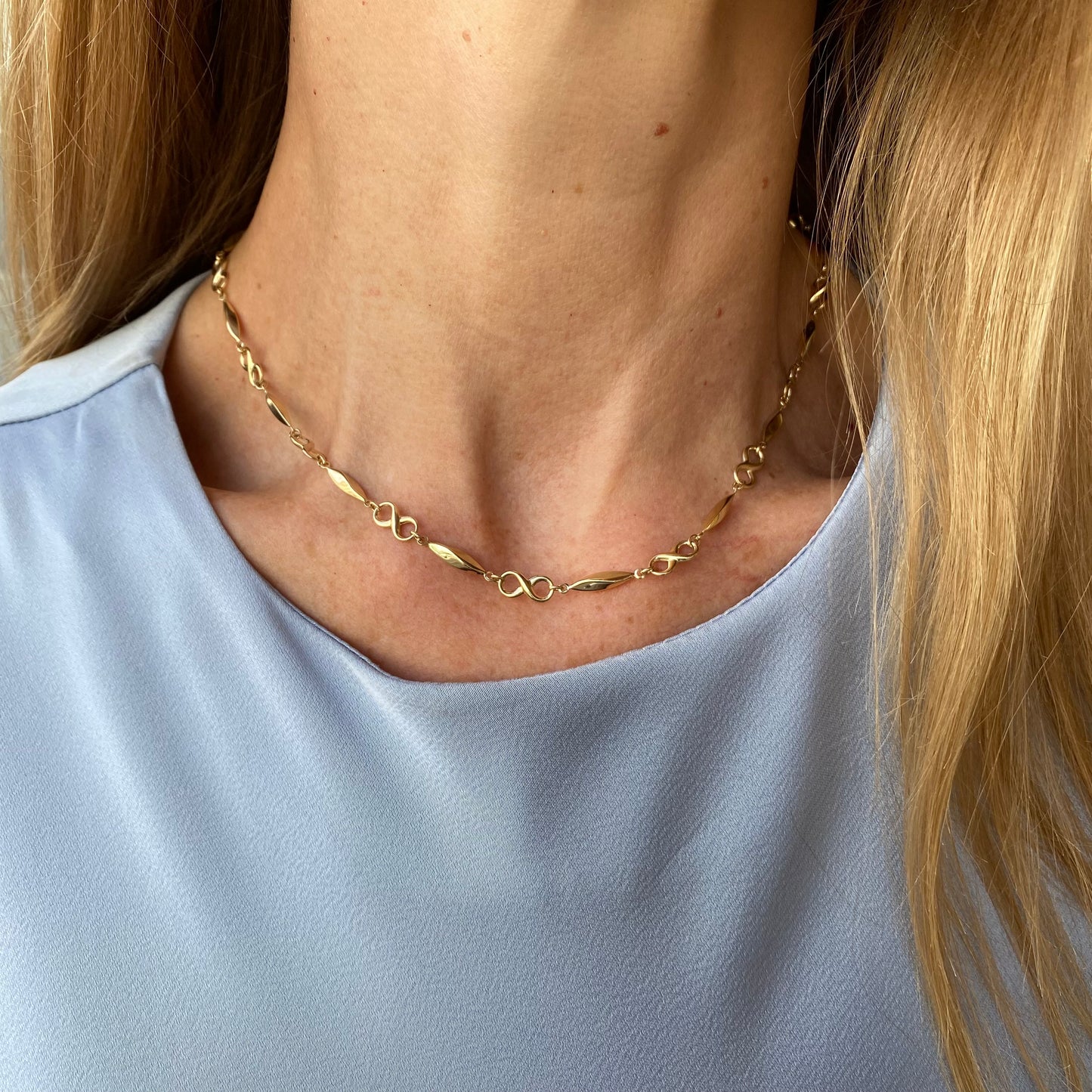 9ct gold long fancy infinity collarette necklace with intricate design, 44cm length, by PJD, displayed on a neutral background.