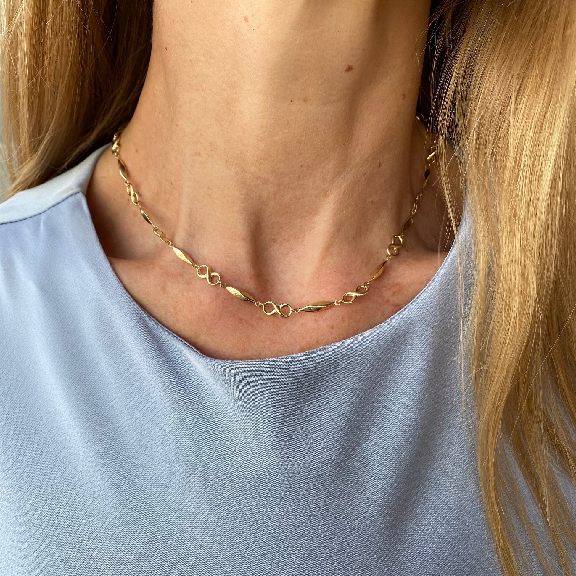 9ct gold long fancy infinity collarette necklace with intricate design, 44cm length, by PJD, displayed on a neutral background.