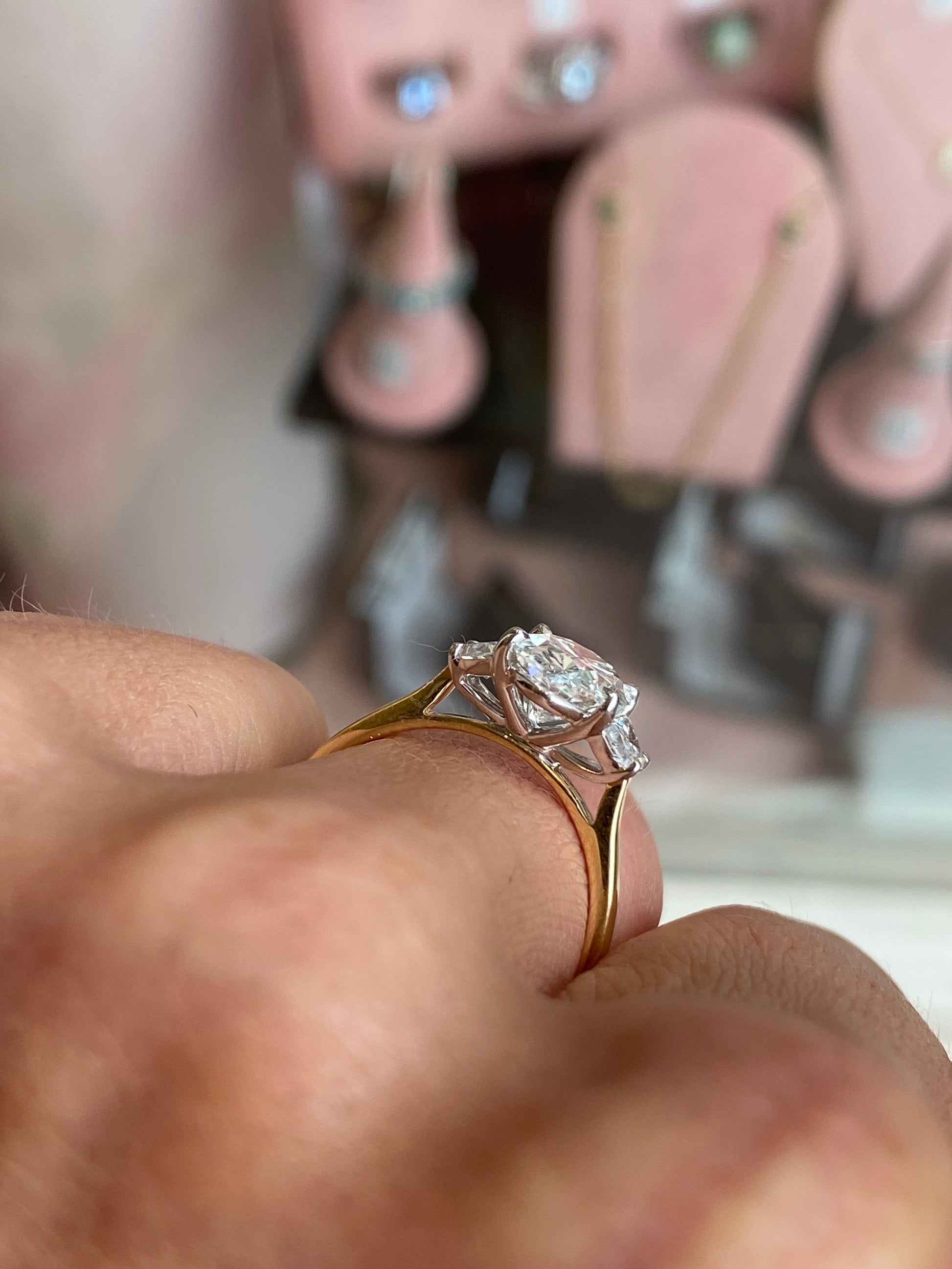 18ct gold trilogy engagement ring by TCA with lab-certified 2.52ct diamonds, featuring a classic design and three sparkling stones.