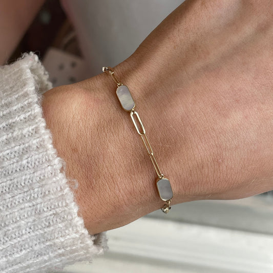 Gold mother of pearl bracelet by Mark Milton featuring elegant, shiny 9ct gold links with iridescent mother of pearl accents.