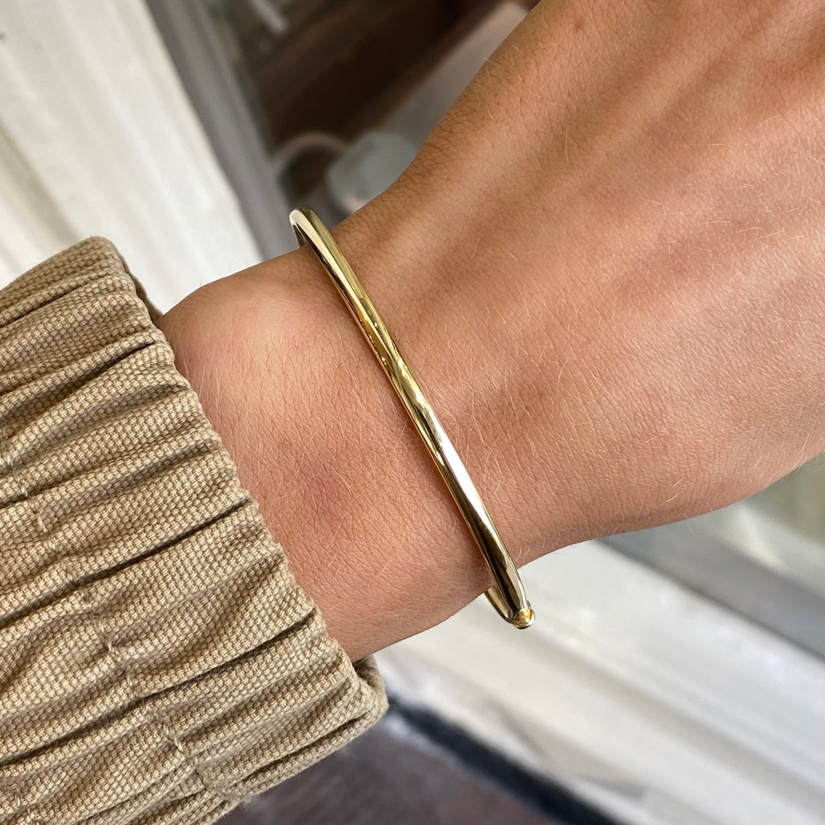 9ct gold plain polished skinny court bangle by Stubbs, 3mm wide, smooth and sleek jewelry accessory.