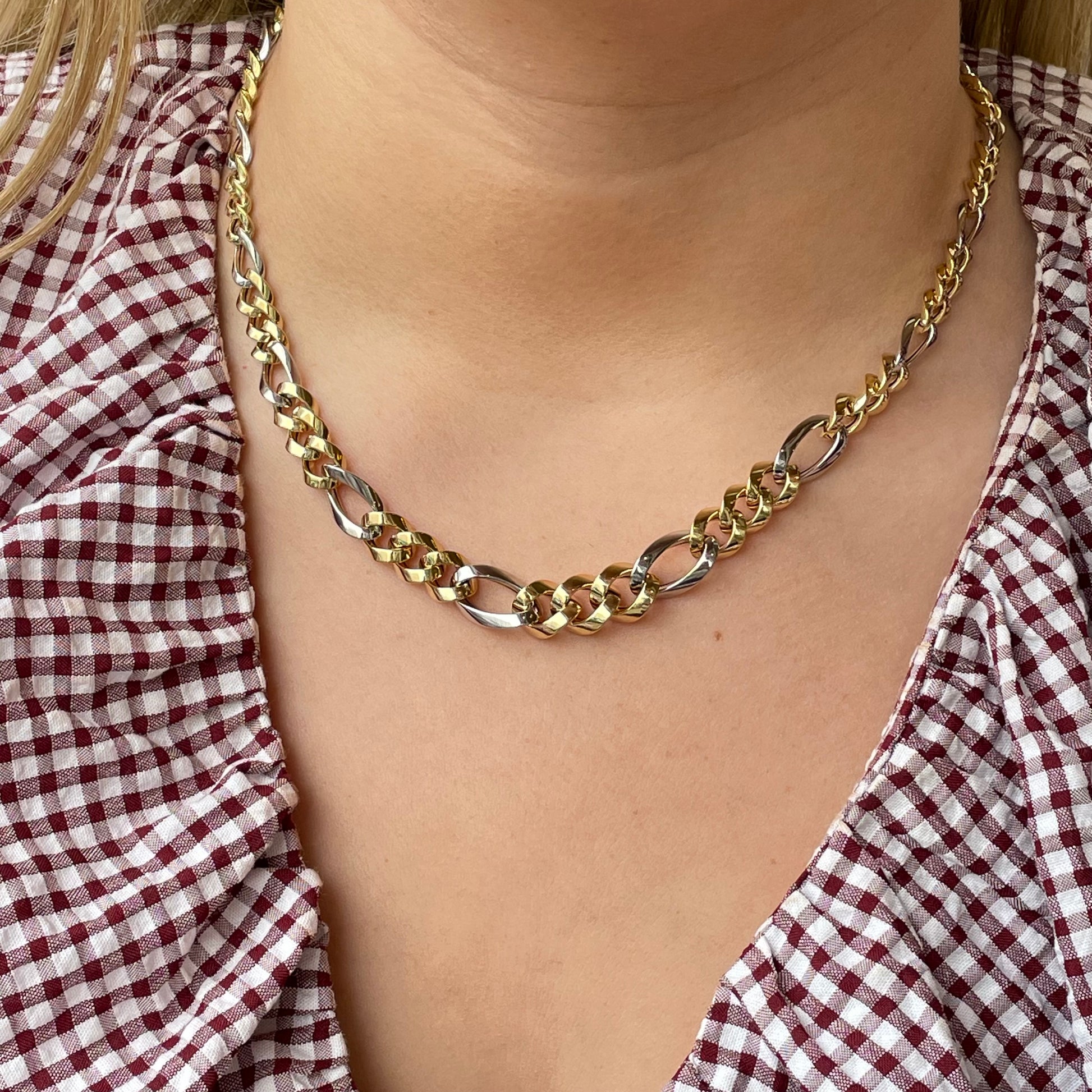 9ct gold two-tone chunky Figaro necklace with bold links, featuring a mix of gold and silver tones, by Mark Milton.