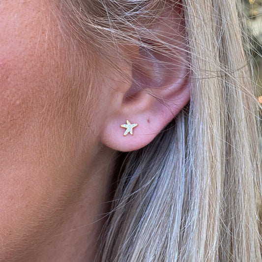 Kid's Sunshine CZ Starfish Stud Earrings by Comero, featuring sparkling starfish design with cubic zirconia accents.