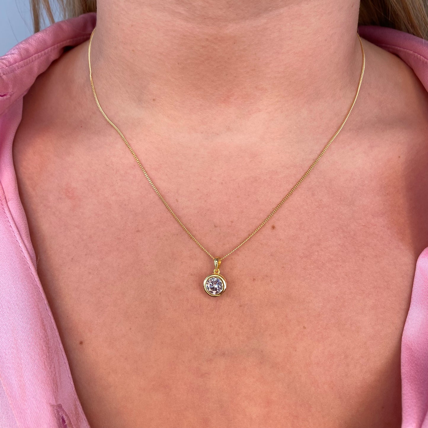 Sunshine CZ earring and necklace set by Insignia featuring round, sparkling cubic zirconia jewelry designs.