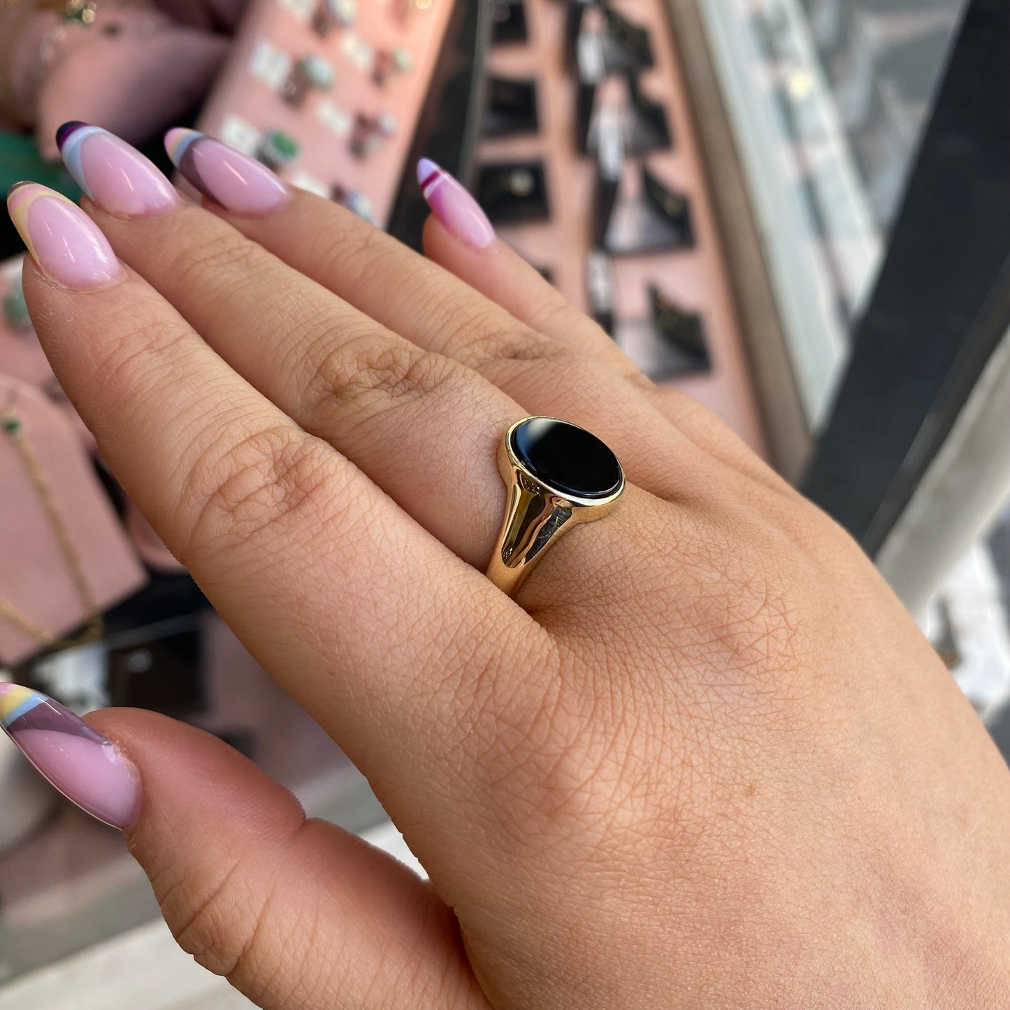 9ct gold men's onyx oval ring by PJD featuring a polished black onyx stone set in a sleek gold band.