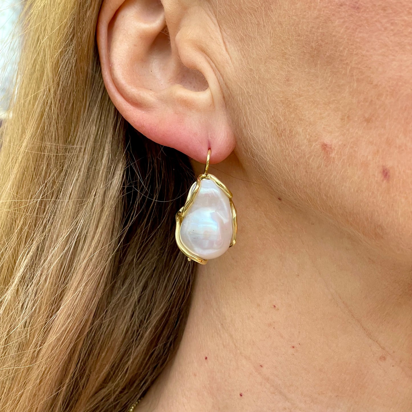 Bruno Baroque Pearl Hook Drop Earrings featuring large irregular pearl dangles on gold hooks.