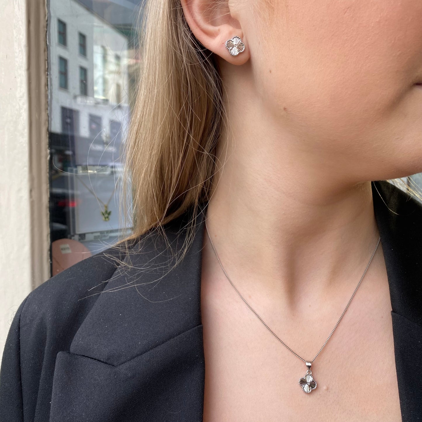Silver Quatrefoil earring and necklace set by Insignia, featuring elegant quatrefoil designs in a coordinated jewelry set.