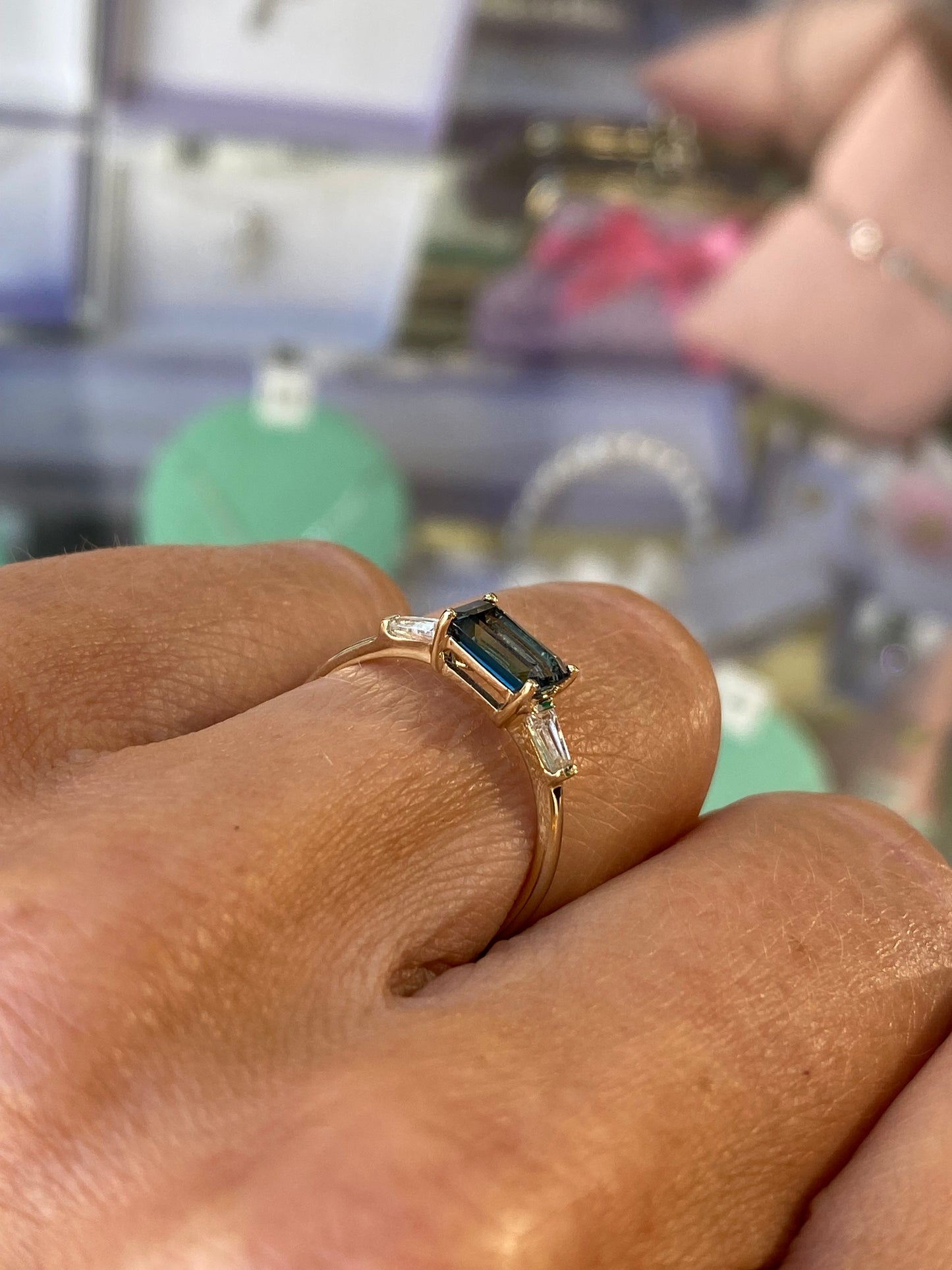 Insignia 9ct gold east-west ring with London Blue Topaz and cubic zirconia gemstones, showcasing a sleek design and vibrant stones.