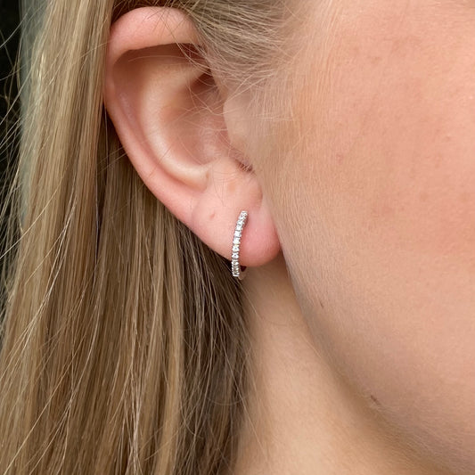 Mirco 18ct white gold diamond hoop earrings with 0.14ct diamonds, showcasing round hoops with sparkling diamond accents.