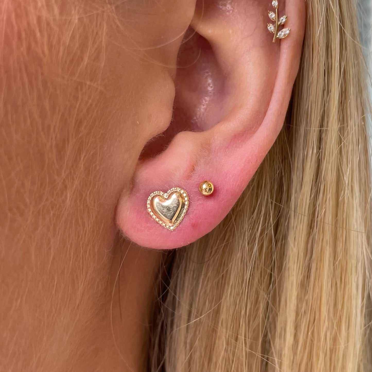 9ct gold pretty heart stud earrings by THC, featuring delicate heart-shaped design and secure post backing.