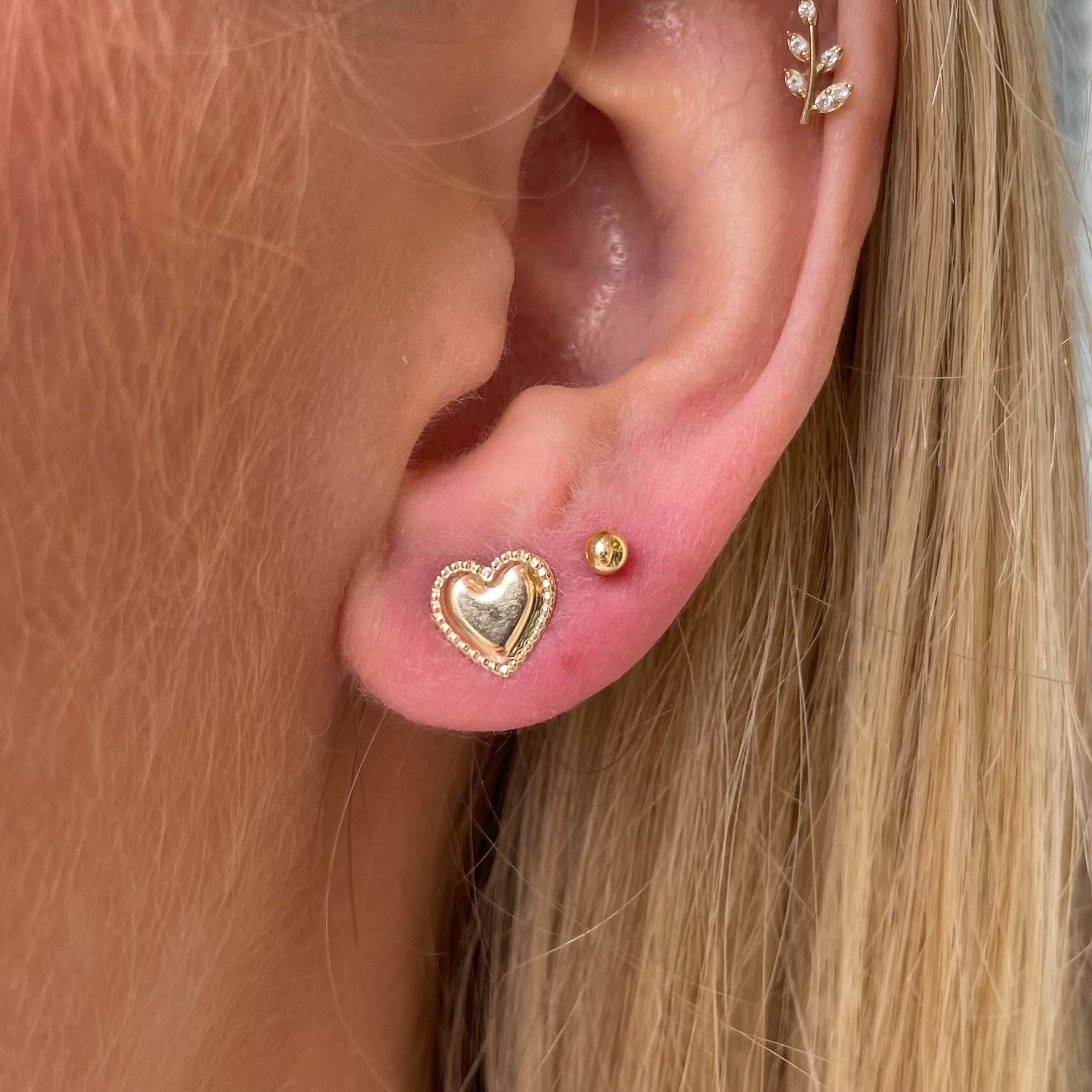 9ct gold pretty heart stud earrings by THC, featuring delicate heart-shaped design and secure post backing.