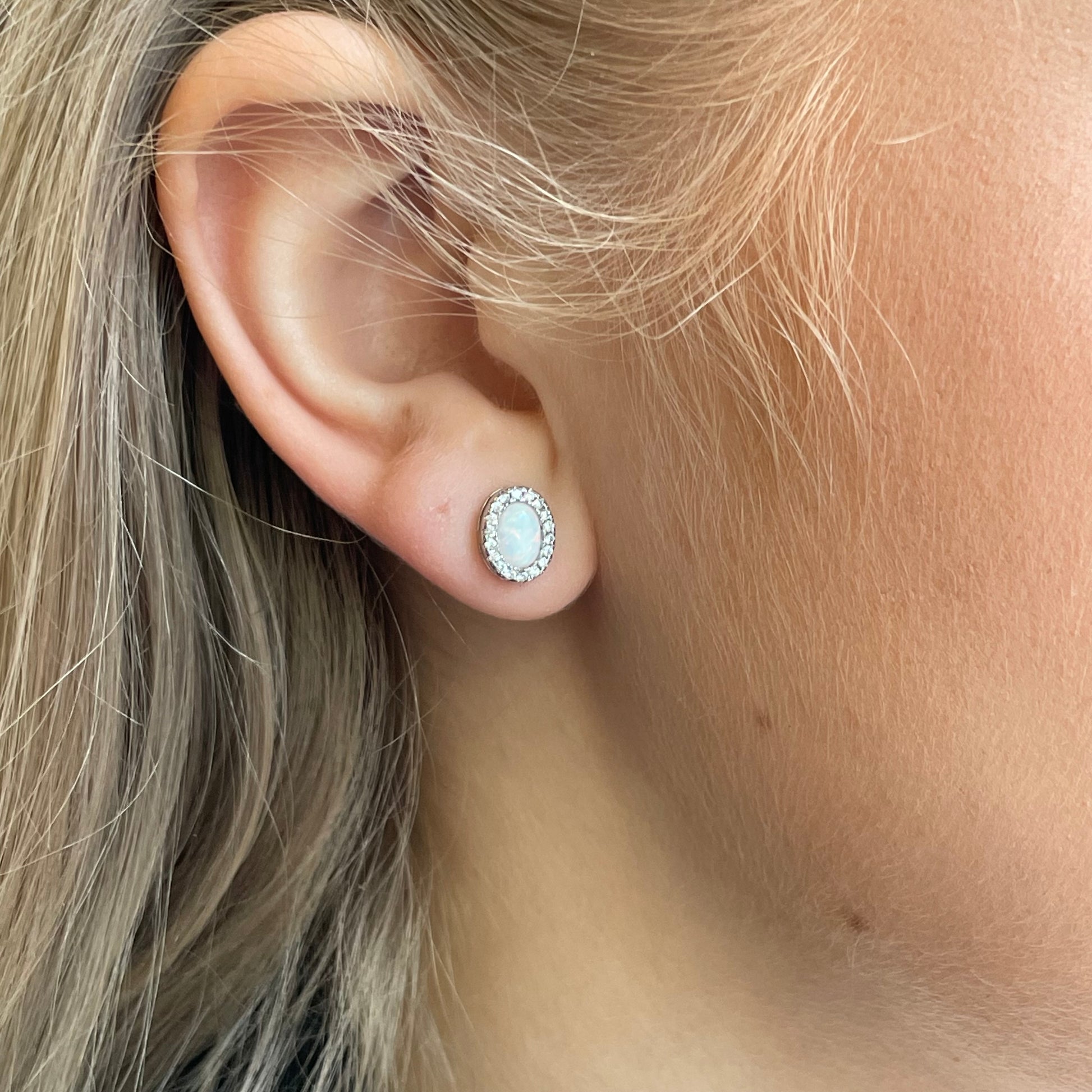 Silver CZ Opalique oval stud earrings by Insignia featuring sparkling cubic zirconia and sleek silver setting.