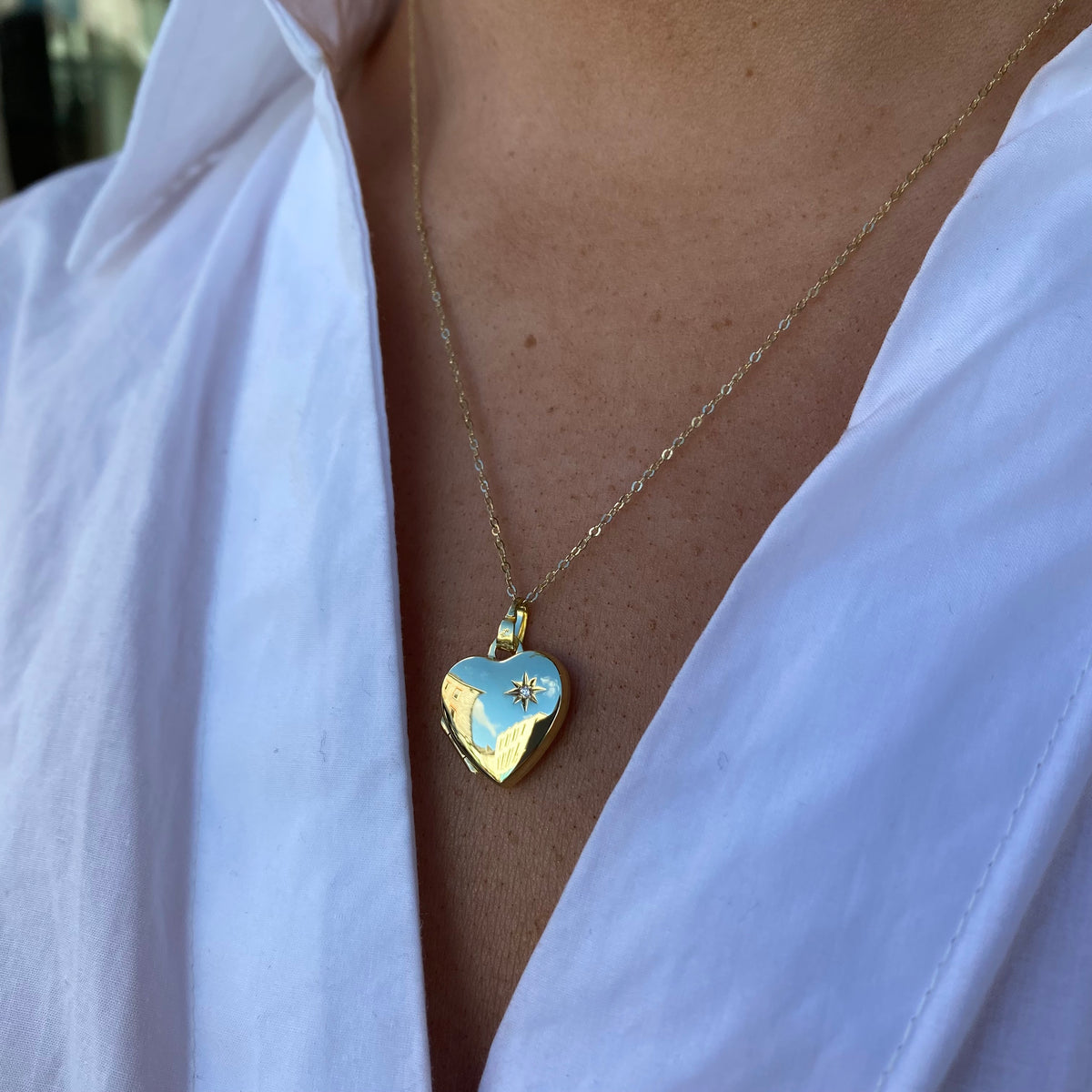 9ct gold diamond heart locket necklace with intricate detailing and sparkling diamonds, by Mark Milton.