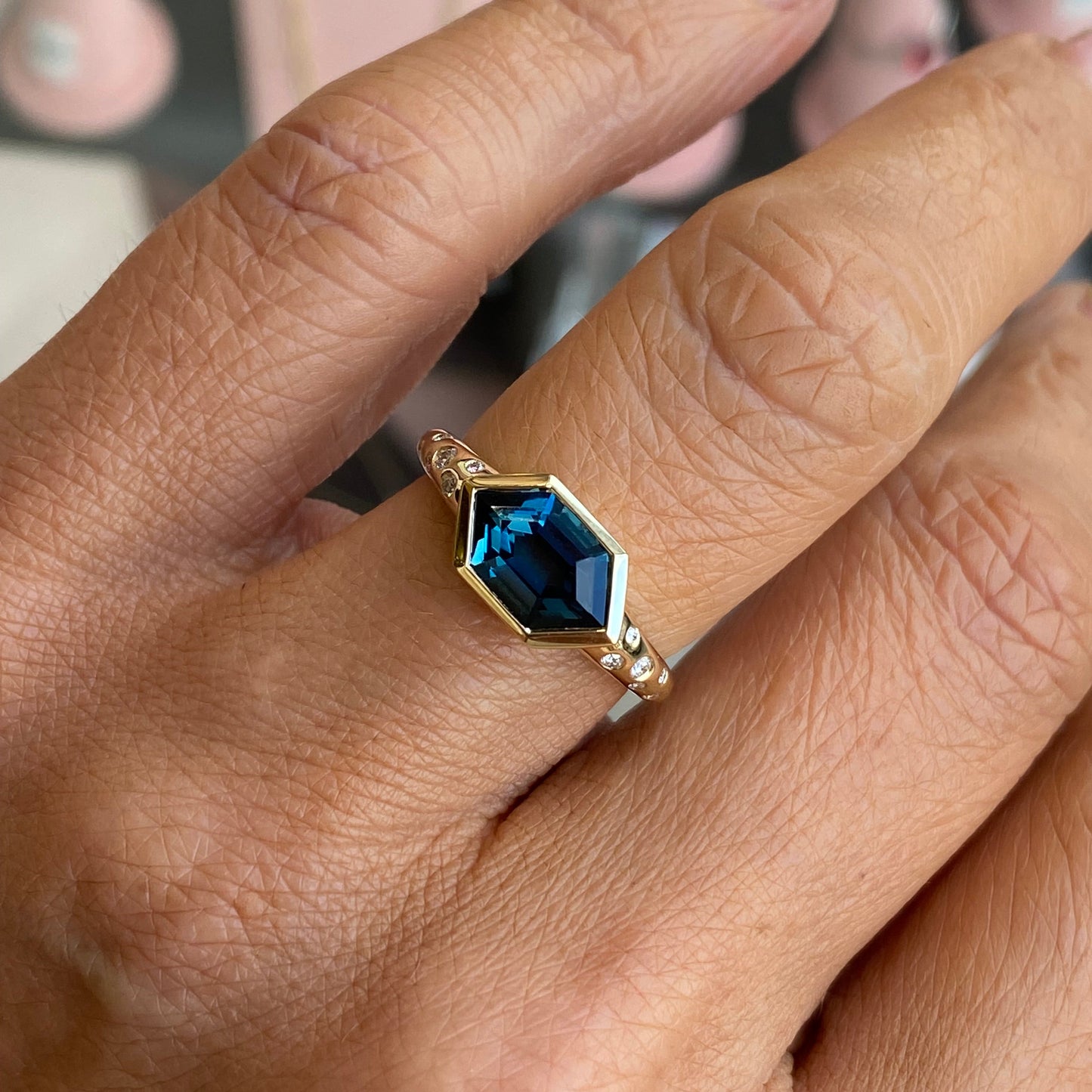 9ct gold London Blue Topaz and diamond ring featuring a large blue topaz gemstone set in a TCA gold band.