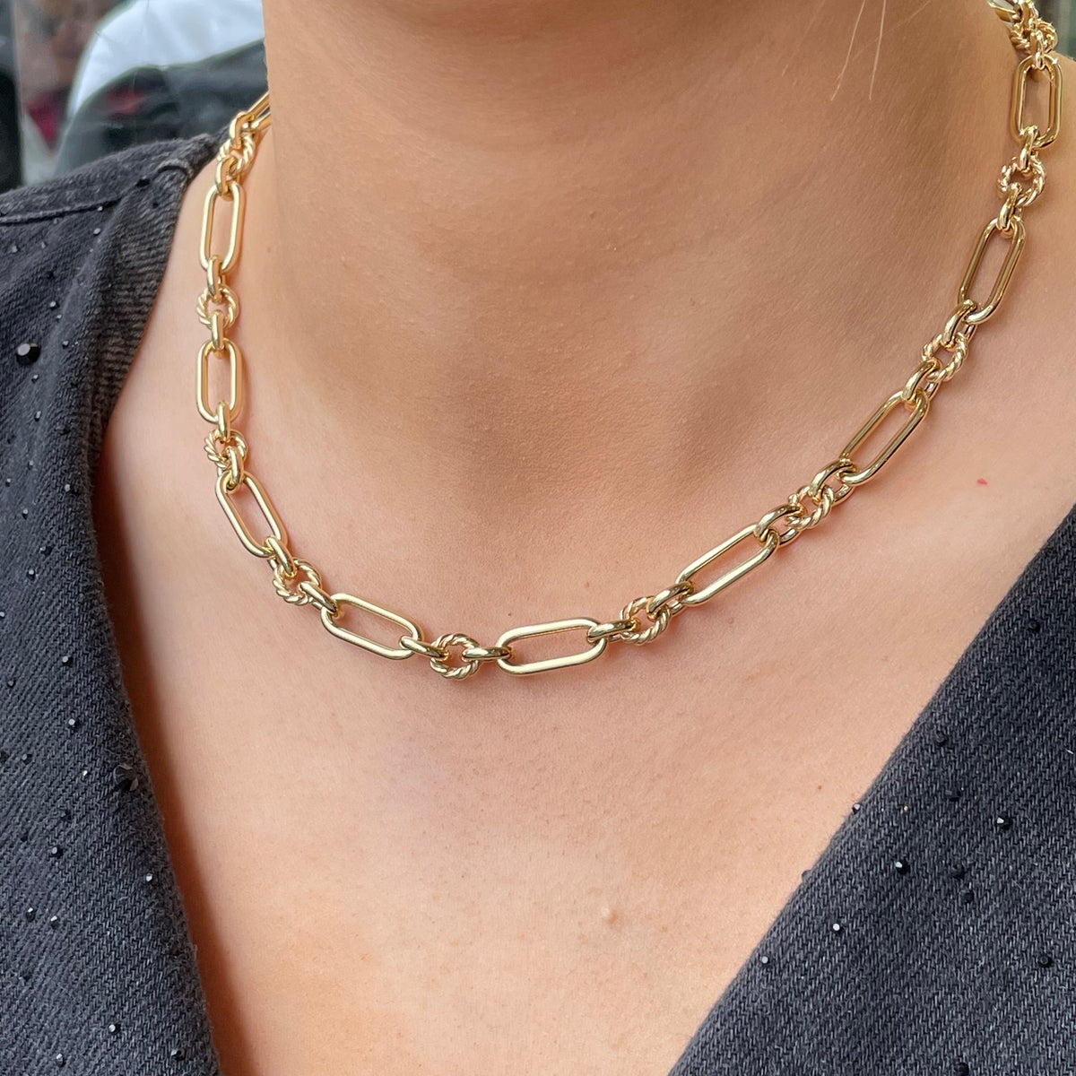 9ct gold long twist link necklace by Mark Milton, showing intricate twisted chain design on a white background.