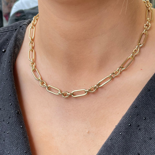 9ct gold long twist link necklace by Mark Milton, showing intricate twisted chain design on a white background.