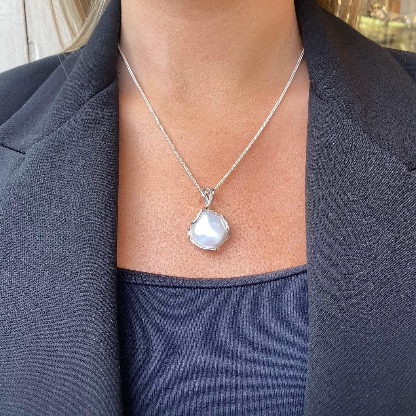 Bruno silver Baroque Pearl pendant necklace featuring a large, irregular pearl on a delicate chain.