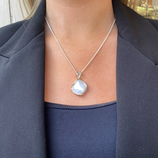 Bruno silver Baroque Pearl pendant necklace featuring a large, irregular pearl on a delicate chain.