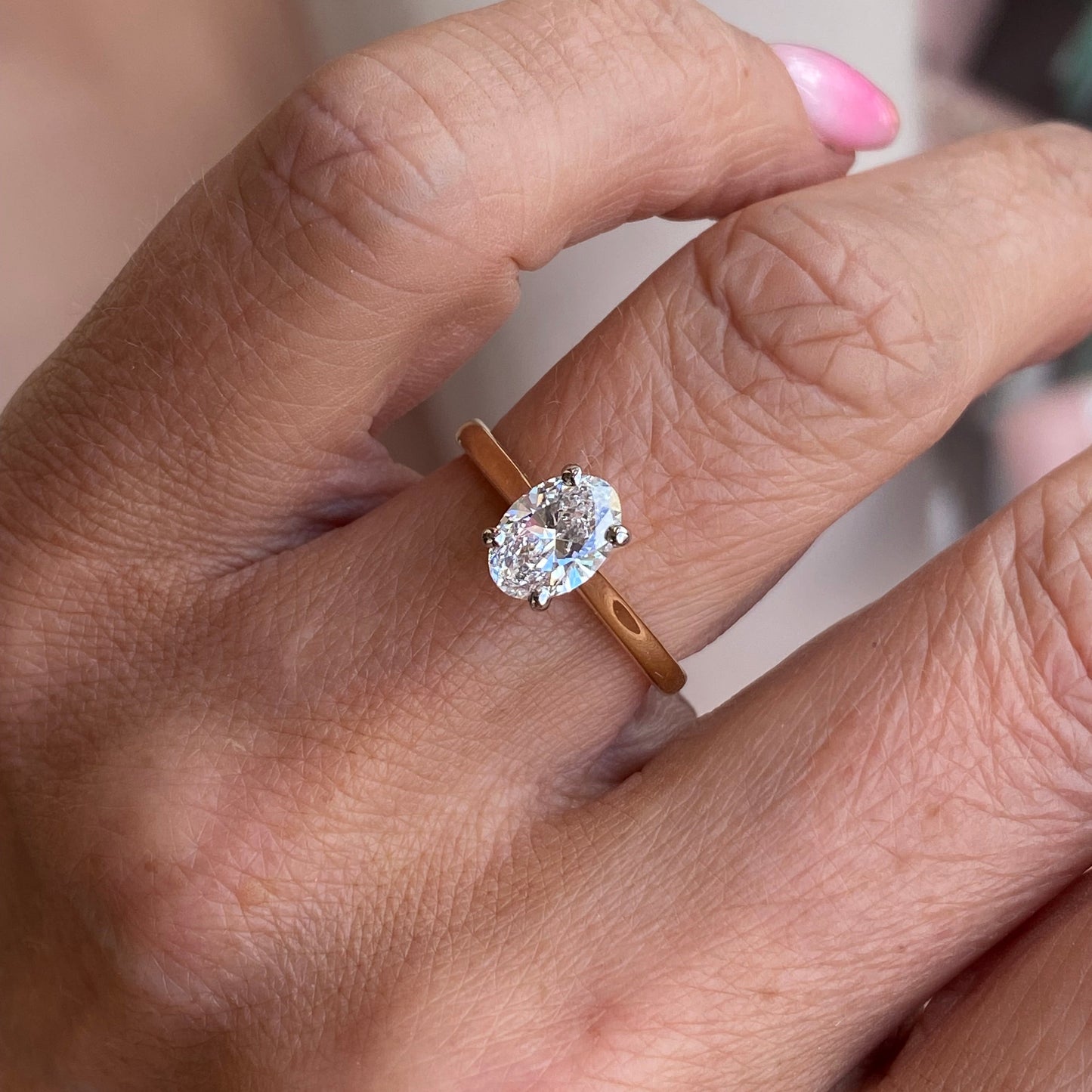 Prima 18ct gold oval solitaire engagement ring with 1.00ct certificated lab diamond, featuring a sleek gold band and classic design.