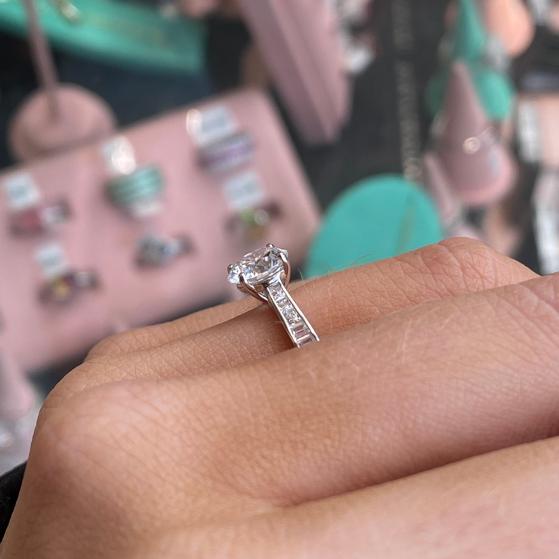 Silver CZ Solitaire Ring by THC featuring a sparkling cubic zirconia stone set in a sleek silver band.