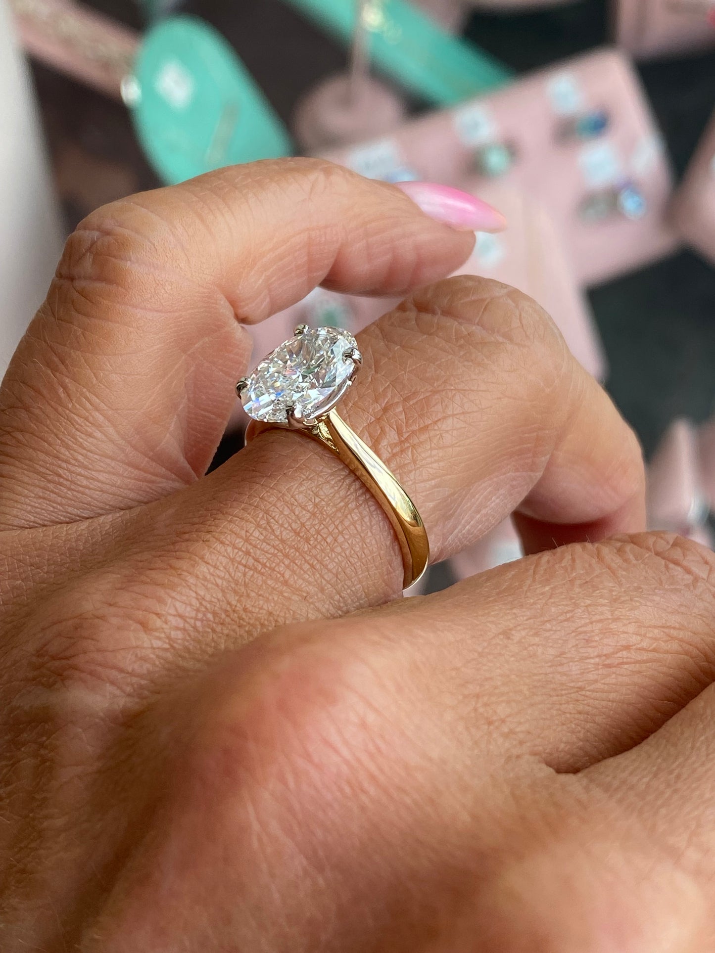 18ct gold oval solitaire engagement ring by Prima with a 3.02ct certificated diamond, showcasing the elegant center stone and gold band.
