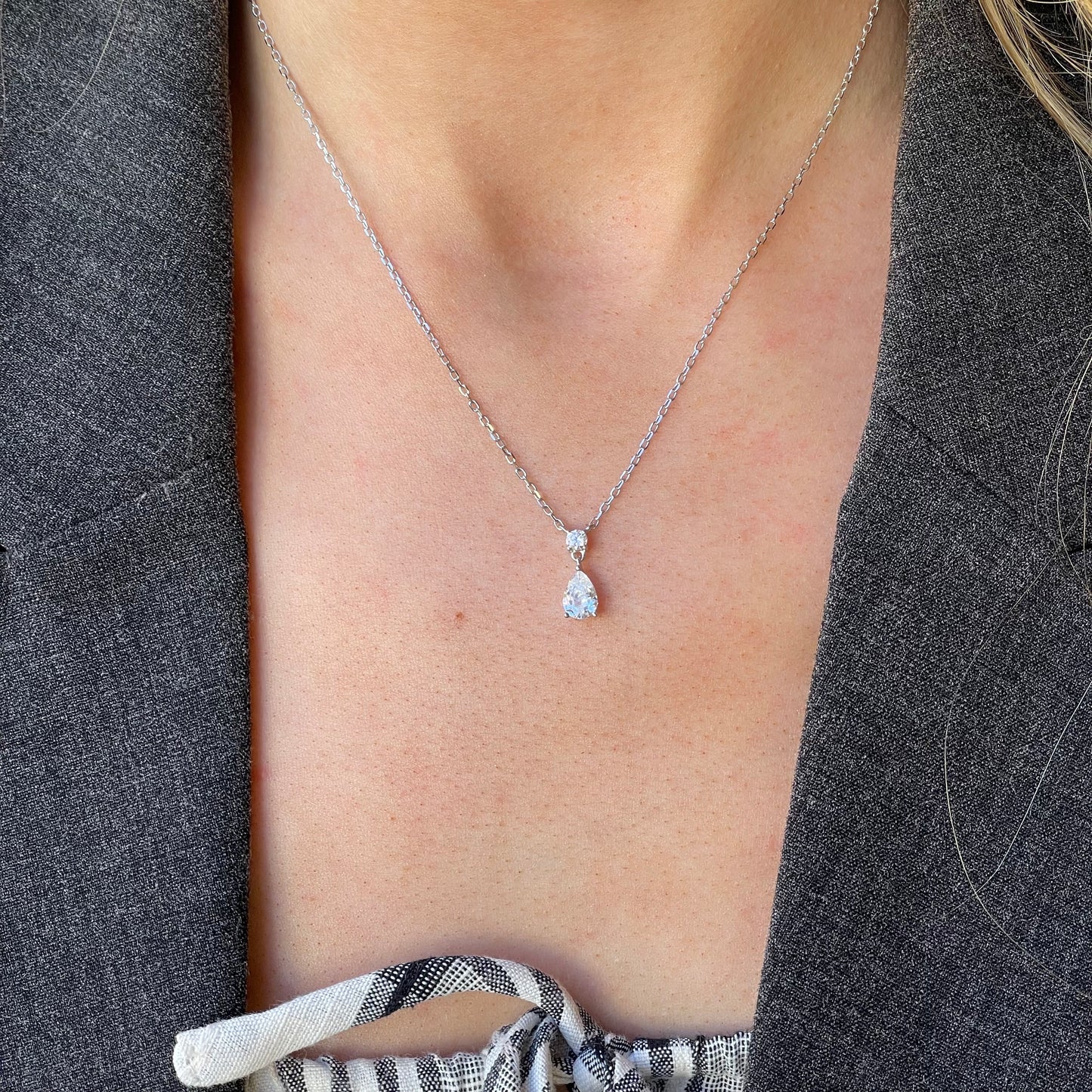Silver Pear CZ Drop Necklace by Comero featuring a dangling pear-shaped cubic zirconia pendant on a 40+5cm chain.