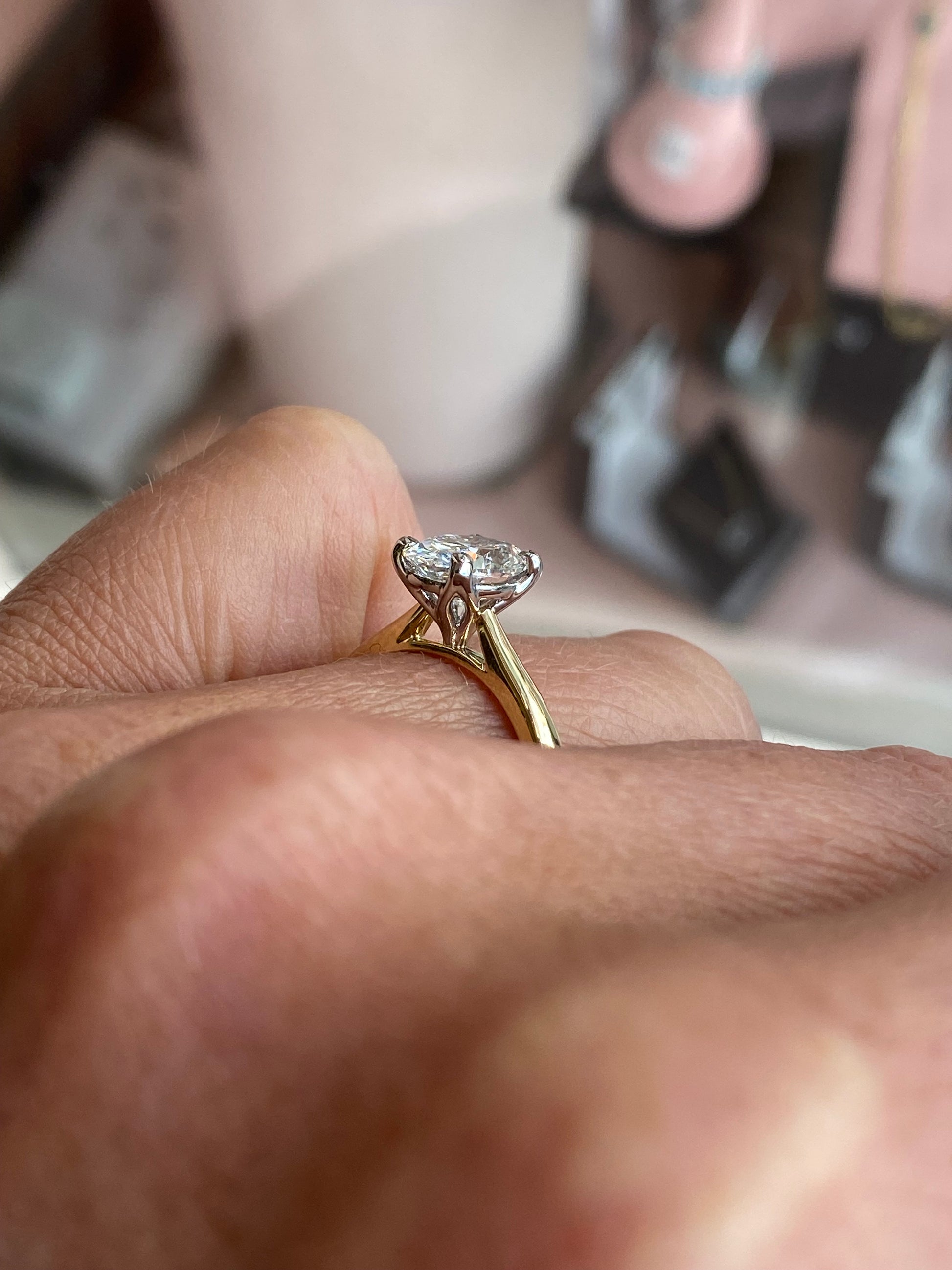 18ct gold oval solitaire engagement ring with 1.51ct certified diamond by Prima, featuring a classic and elegant design.