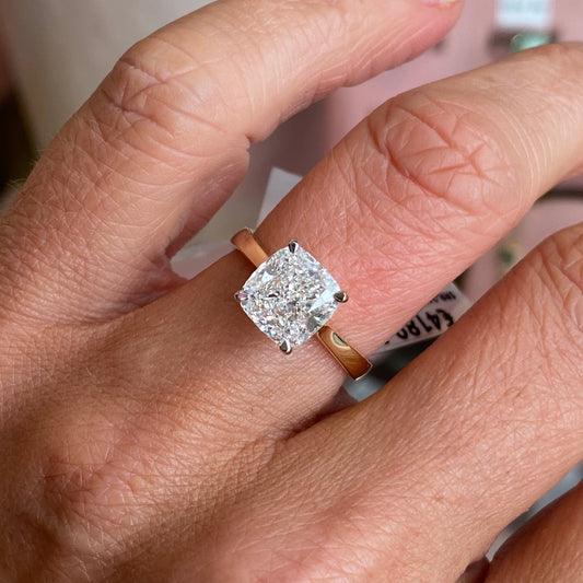 TCA 18ct gold cushion solitaire engagement ring with 3.02ct certificated lab diamond, elegant jewelry piece.
