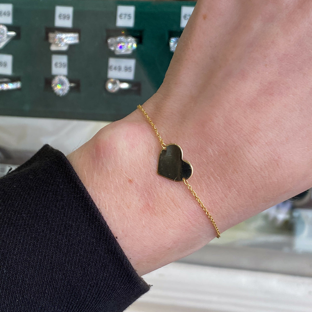 9ct gold heart disc identity bracelet featuring a delicate chain and engraved heart charm, designed by THC.