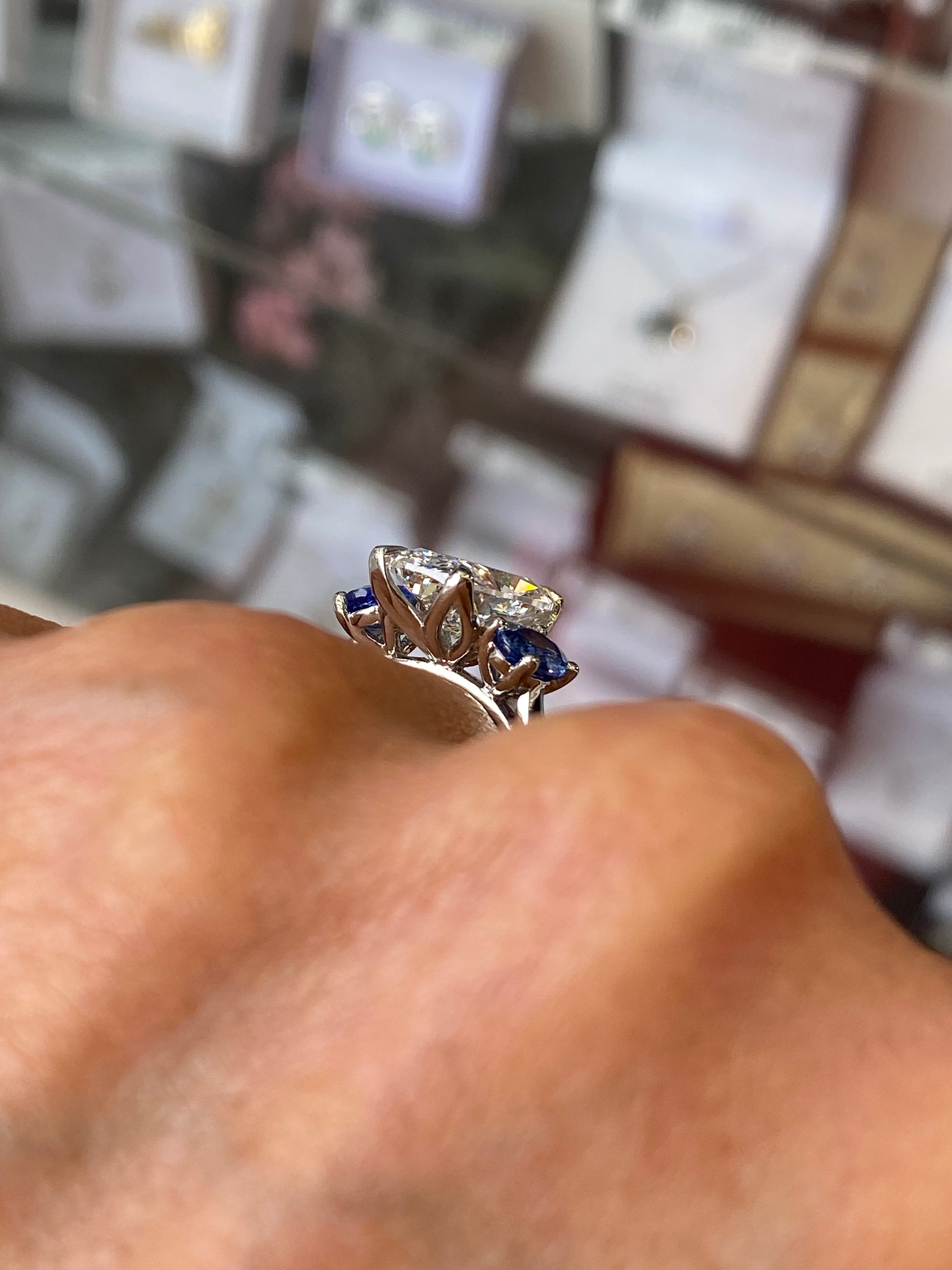 Platinum Elongated Cushion & Sapphire Trilogy Ring - John Ross Jewellers