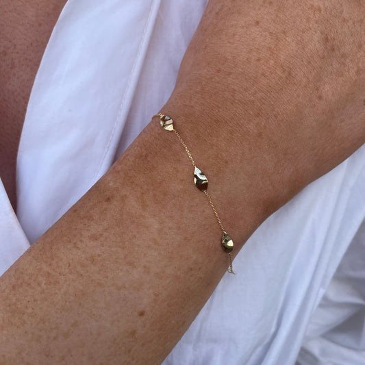 9ct gold five leaves bracelet with delicate leaf design by Mark Milton, showcasing elegant craftsmanship and fine jewelry details.