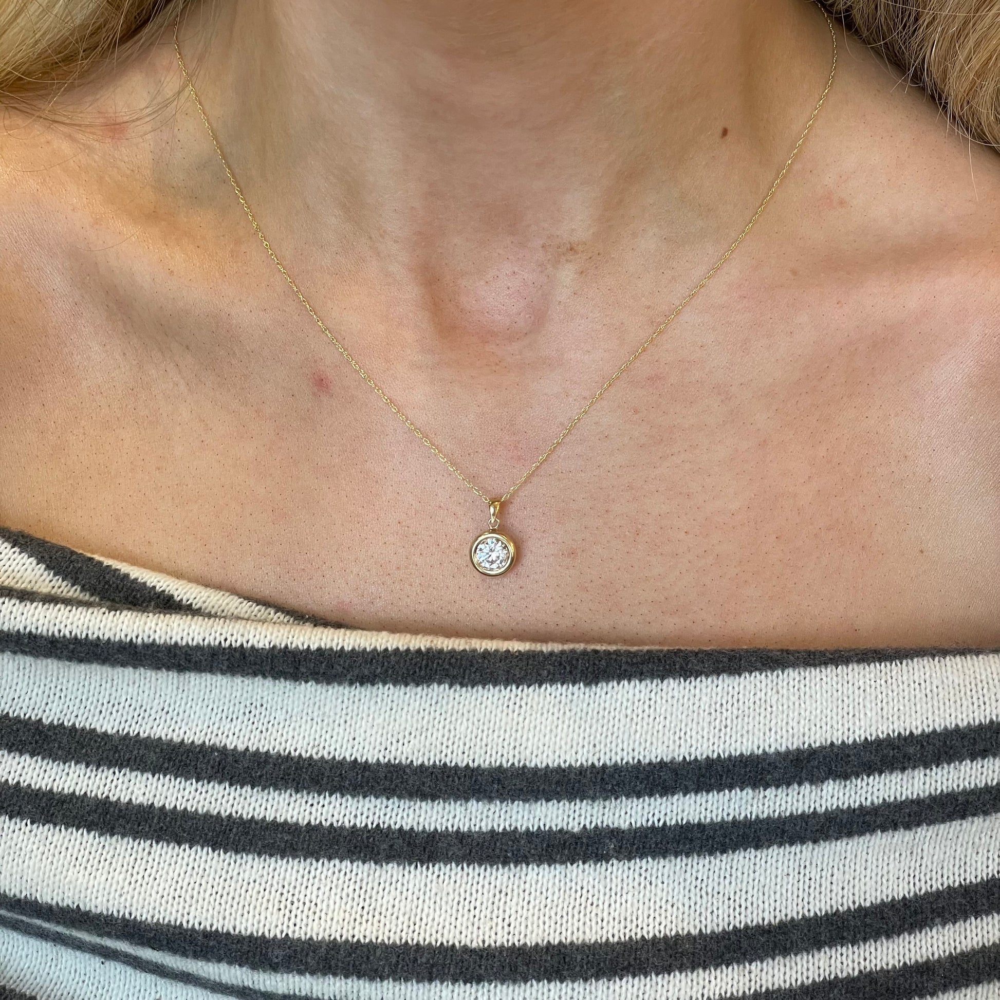 9ct gold bezel set CZ necklace with a 6mm round cubic zirconia, elegant jewelry piece by NJO.