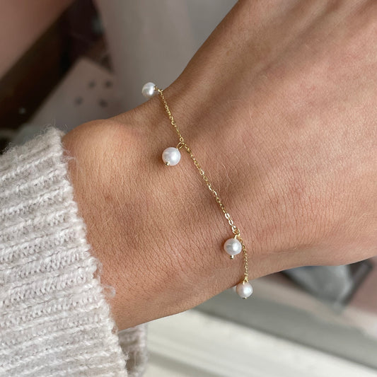 Mark Milton 9ct gold freshwater pearl drop bracelet with elegant pearl pendants on a delicate gold chain.