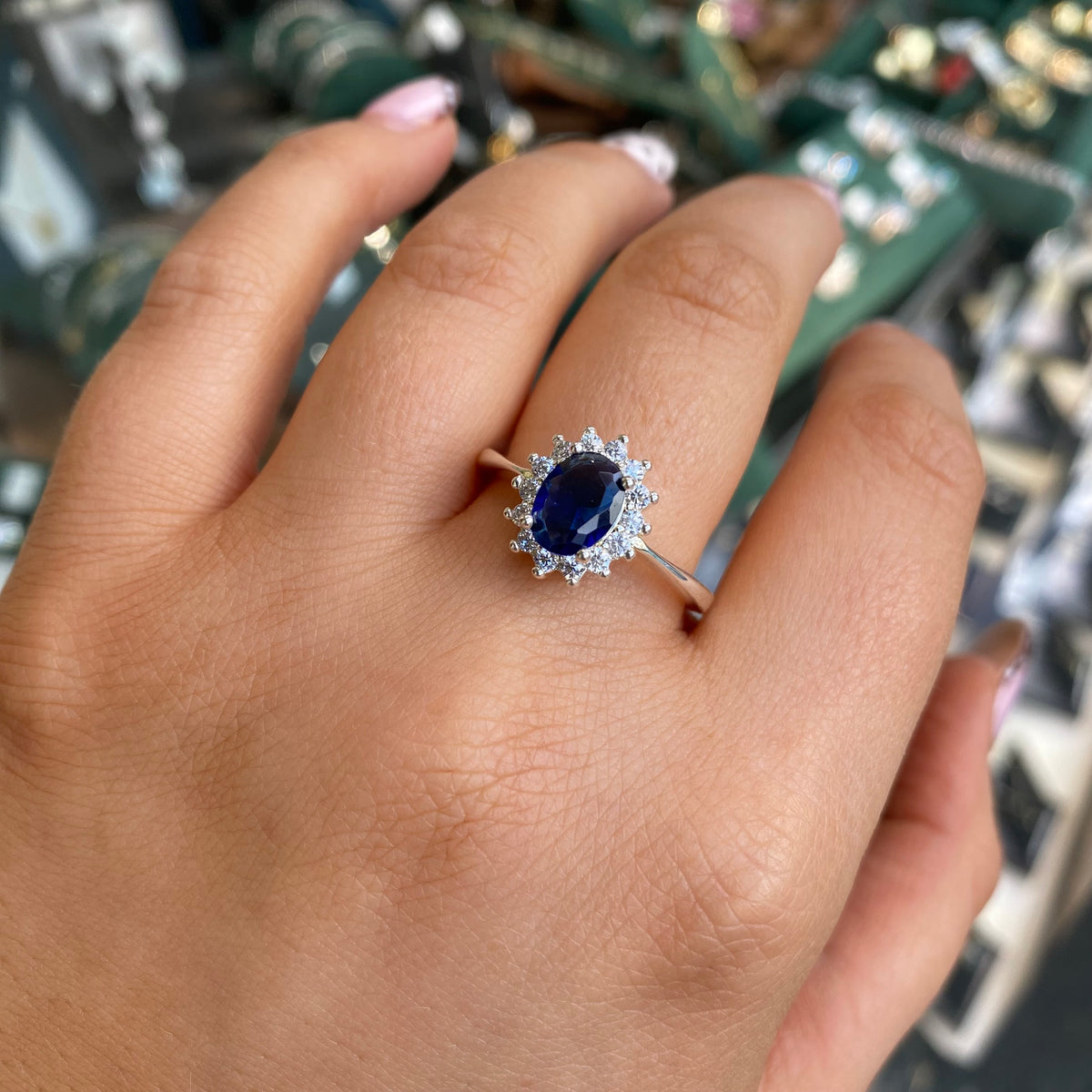 Kurate Silver Sapphire CZ Diana Ring featuring a silver band with sparkling sapphire and cubic zirconia accents.