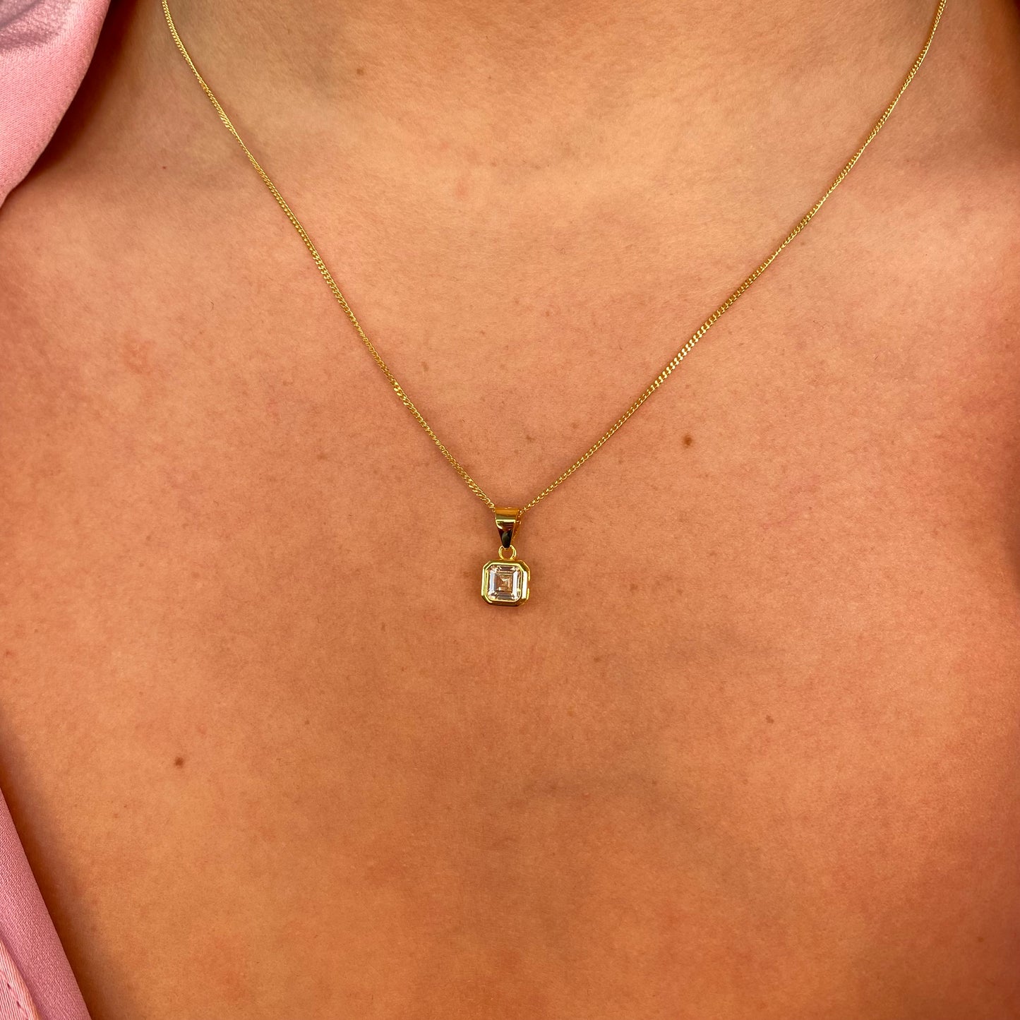 Sunshine CZ earring and necklace set by Insignia featuring sparkling cubic zirconia jewelry with gold-tone finish.