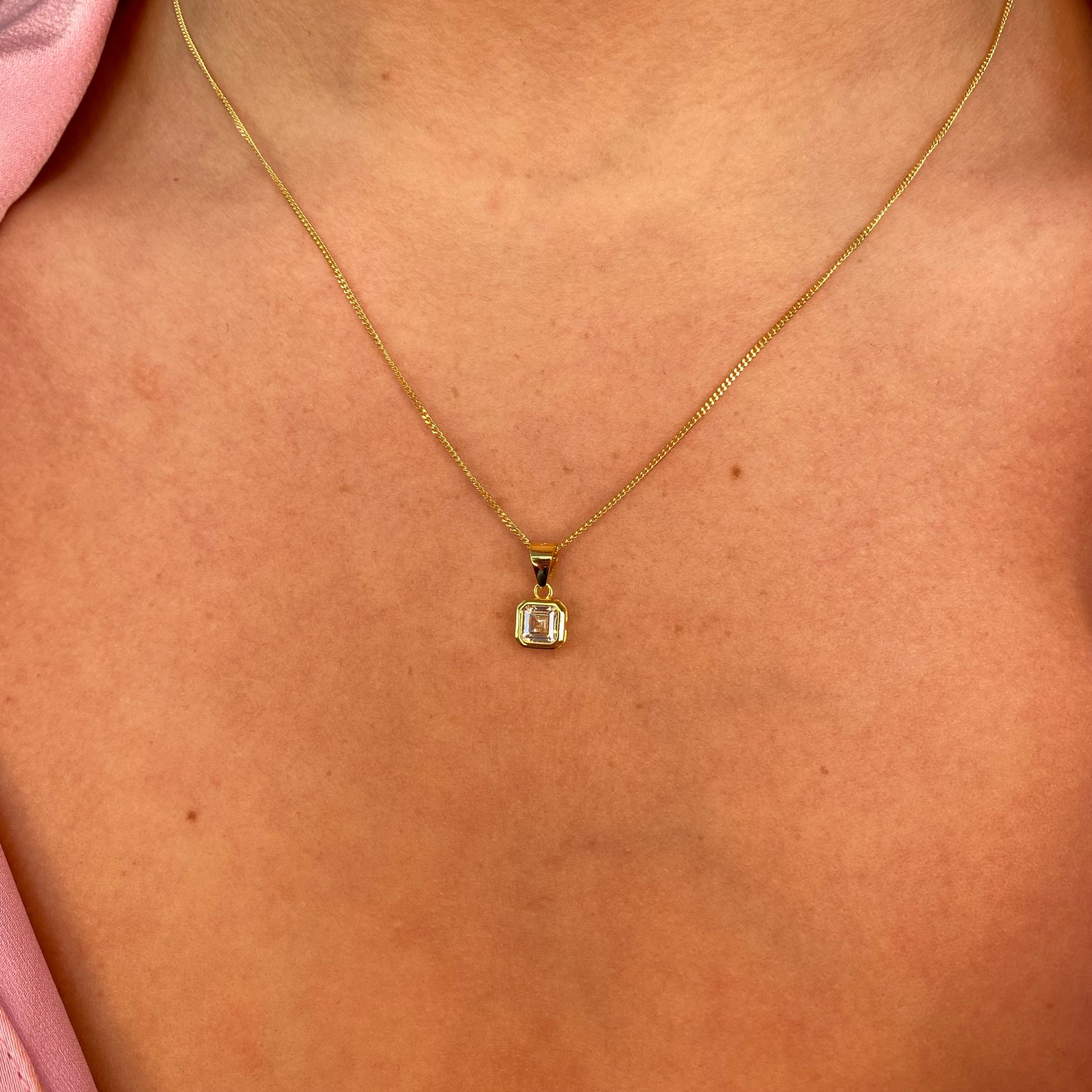 Sunshine CZ earring and necklace set by Insignia featuring sparkling cubic zirconia jewelry with gold-tone finish.