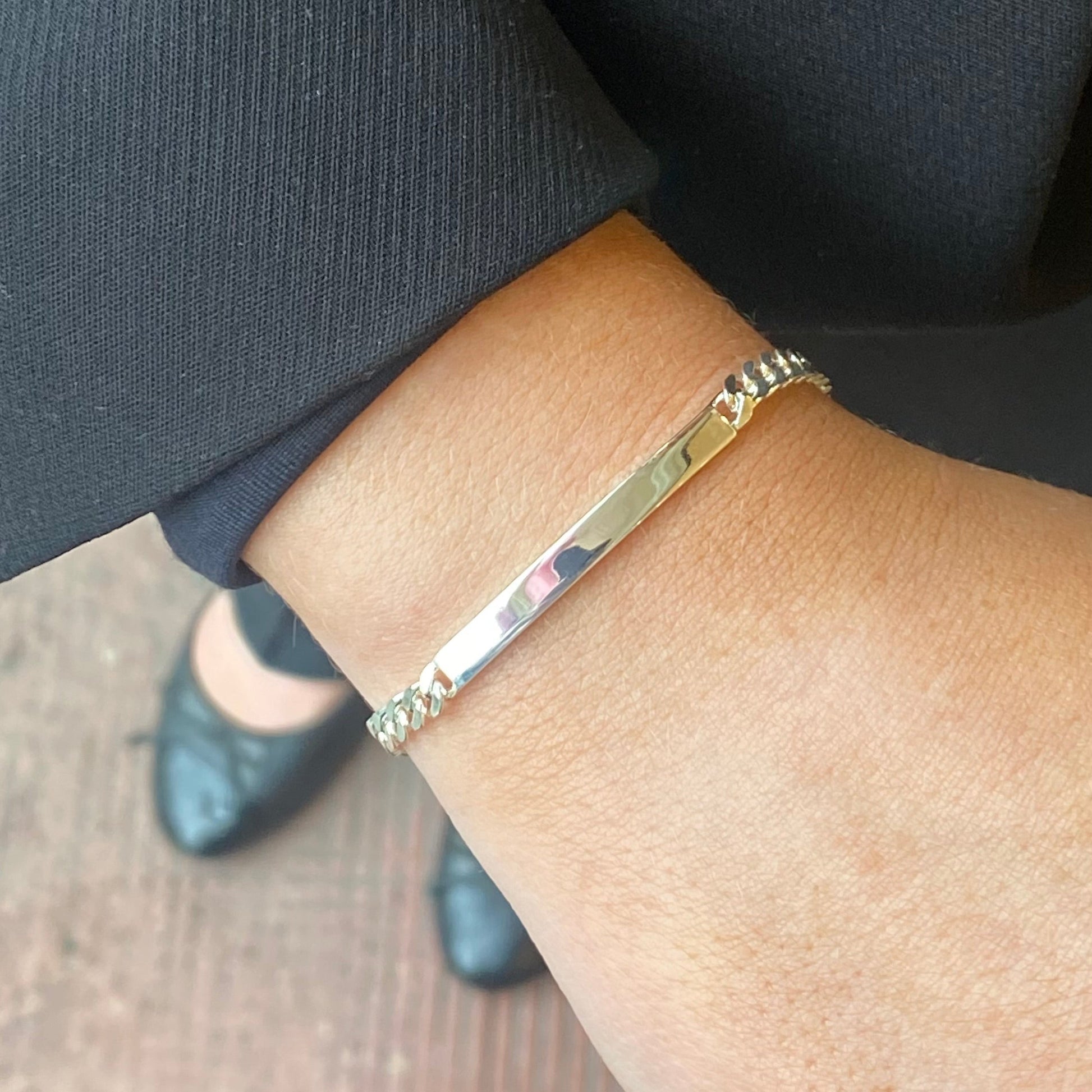Silver Insignia identity bracelet, 19cm length, featuring a sleek design with engraved details and secure clasp.