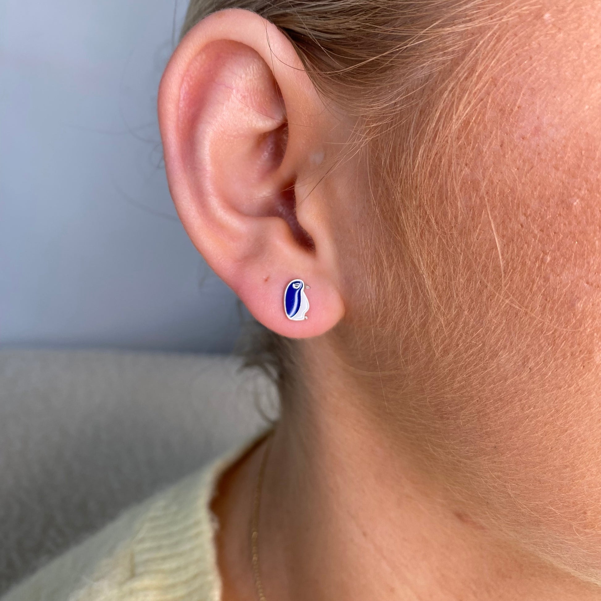 Silver penguin stud earrings for kids by Comero, featuring cute penguin designs with shiny silver finish.