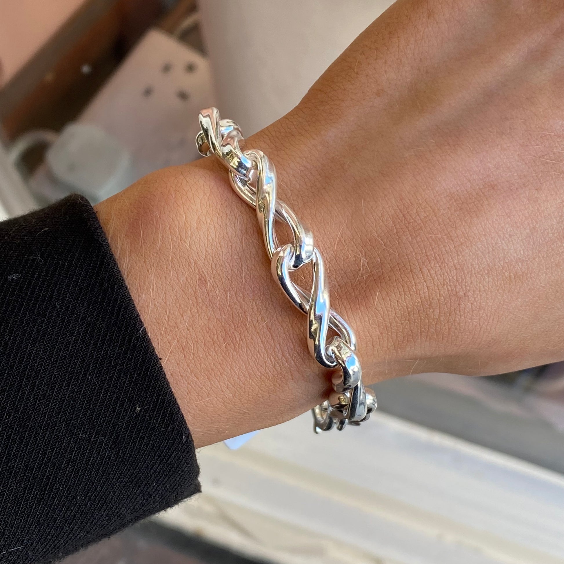Silver chunky ribbon twist bracelet by Insignia, 20cm, featuring a bold, textured design with a smooth clasp.