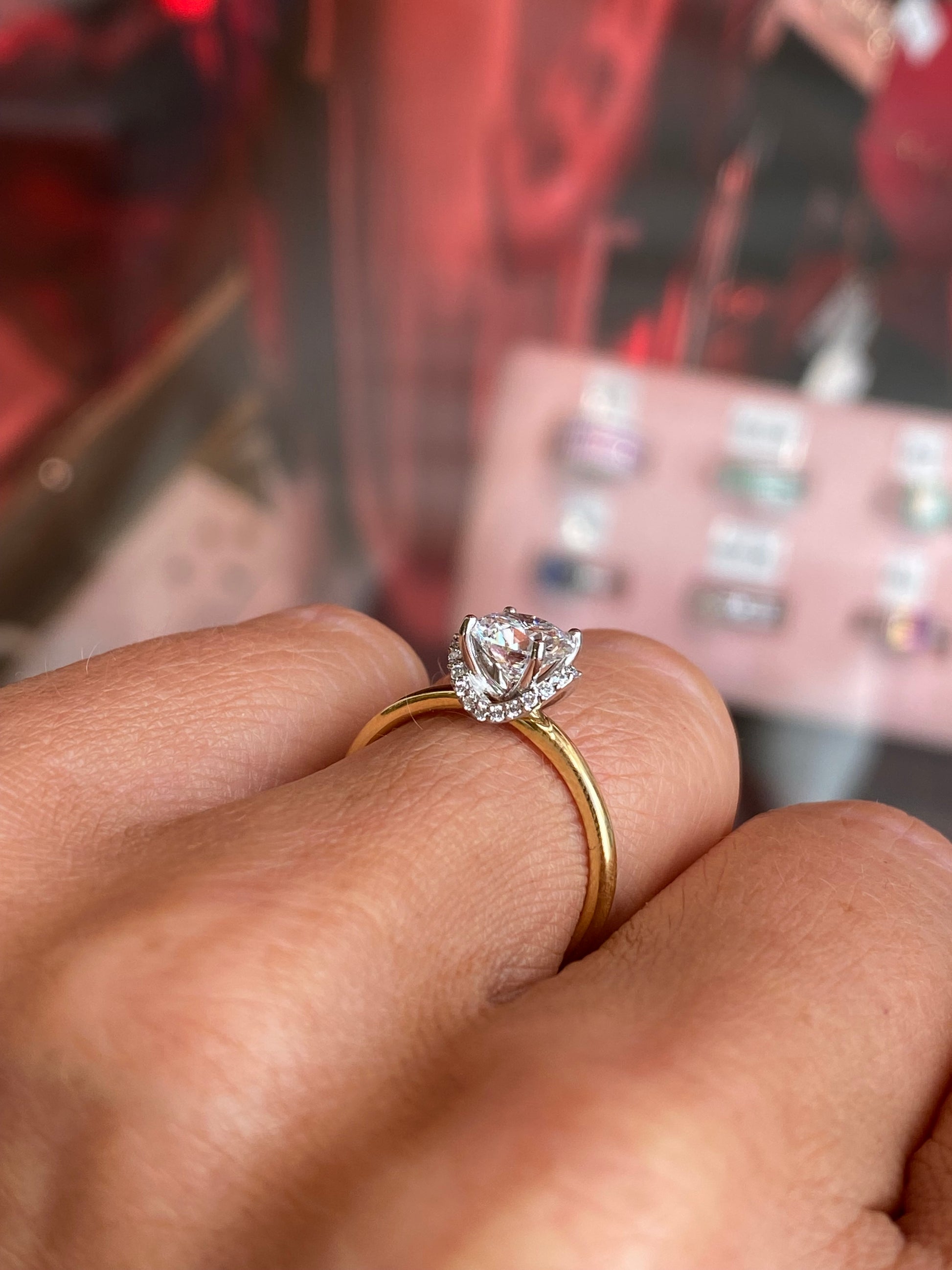 18ct gold chevron halo solitaire engagement ring with a 1.01ct certified lab diamond by Domino, featuring a sleek design.