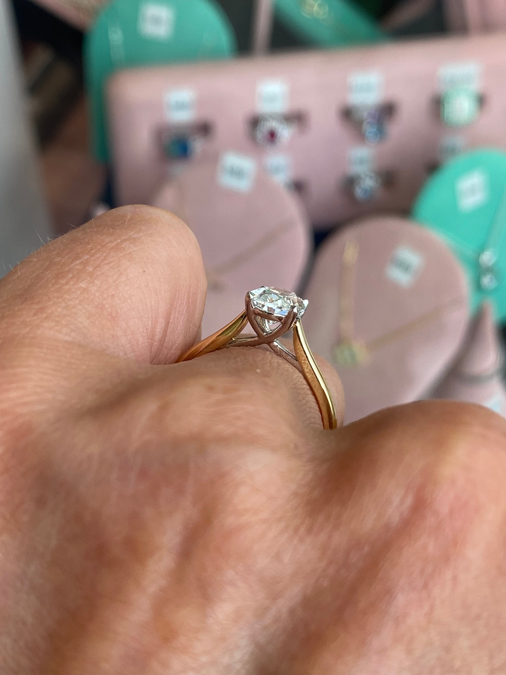 18ct gold oval solitaire engagement ring with 1.51ct certified diamond by Domino, showcasing a sleek and elegant design.