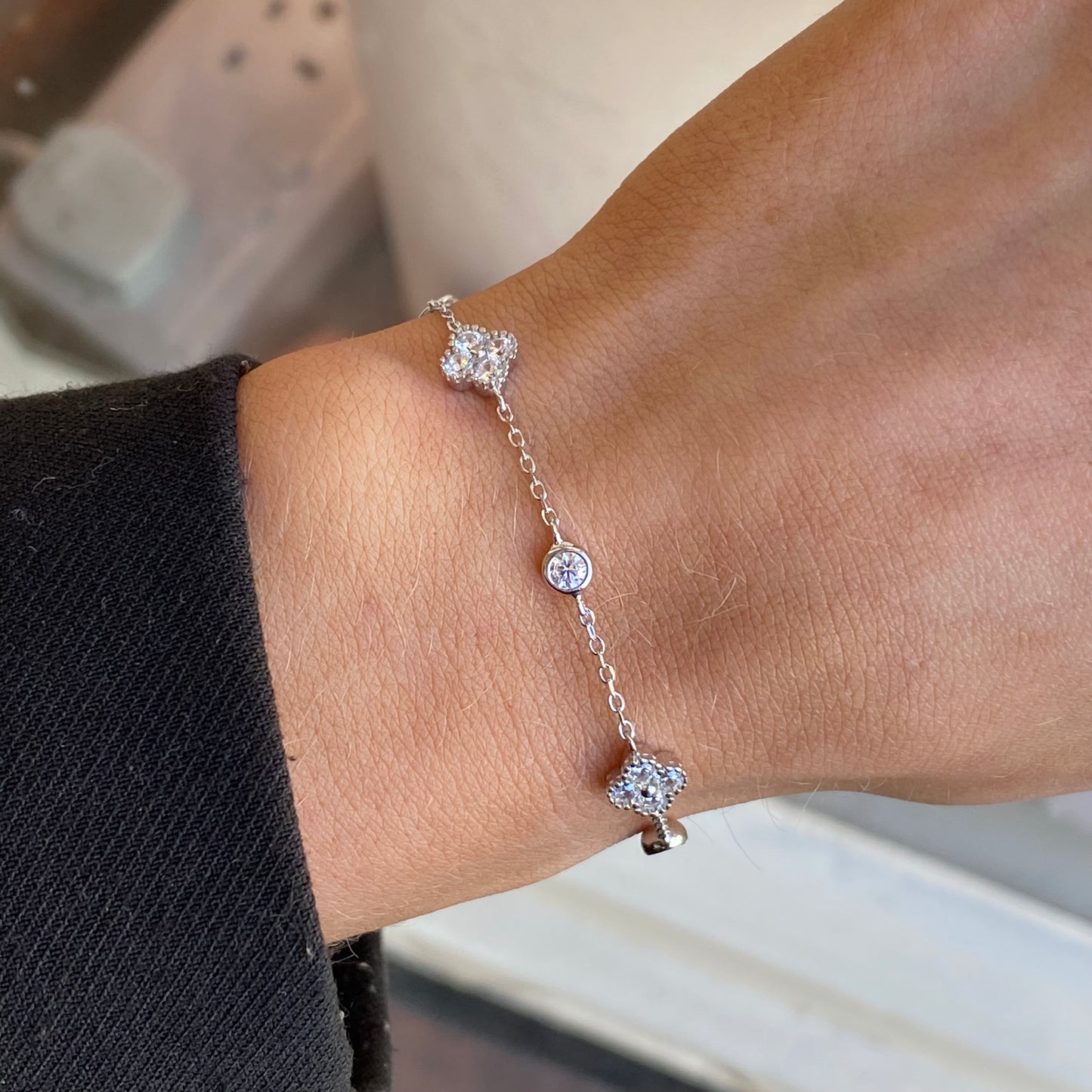 Silver CZ Quatrefoil bracelet by Insignia featuring four-leaf clover-shaped charms on a delicate link chain.