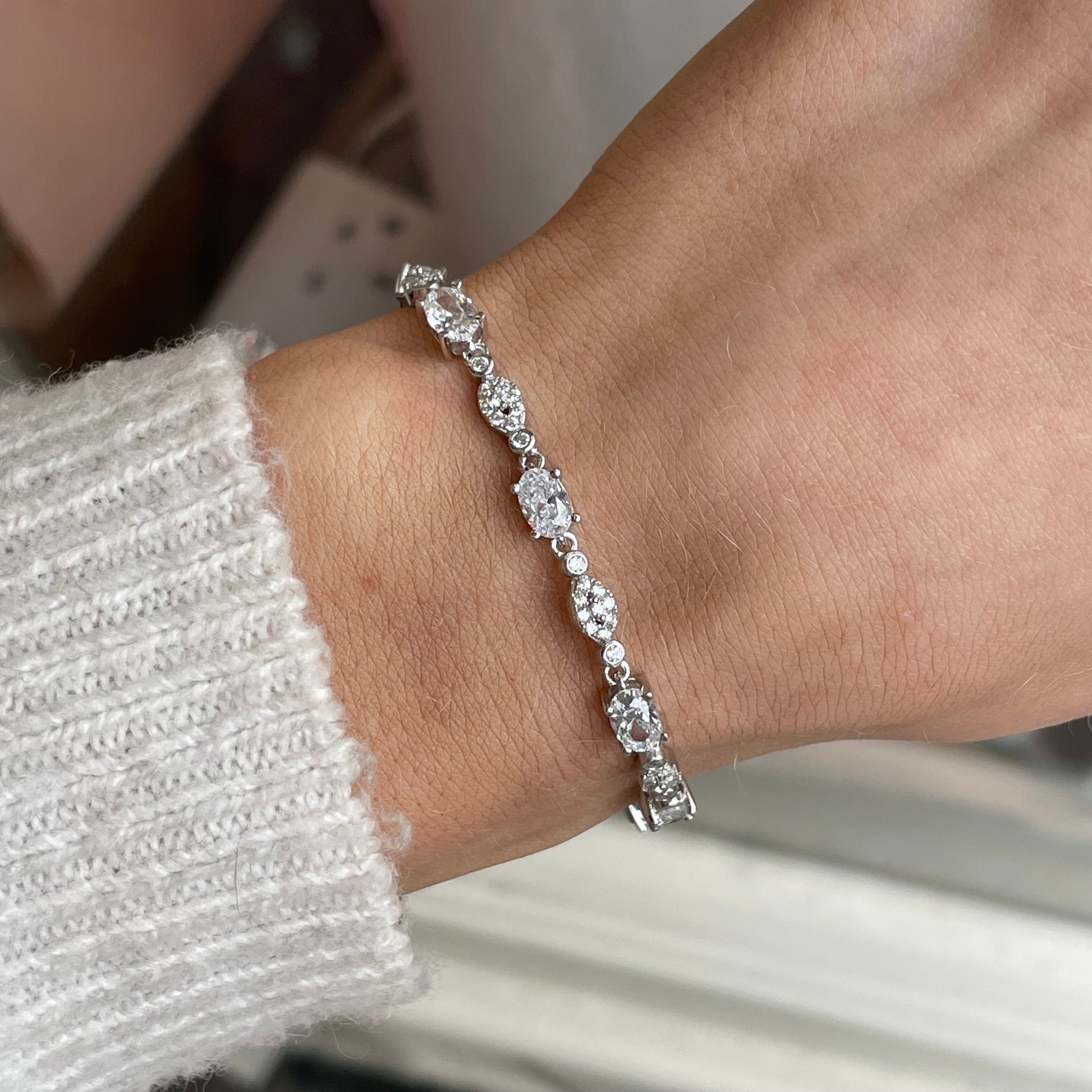 Silver CZ fancy tennis bracelet by Comero featuring sparkling cubic zirconia stones and a 17+3cm adjustable length.