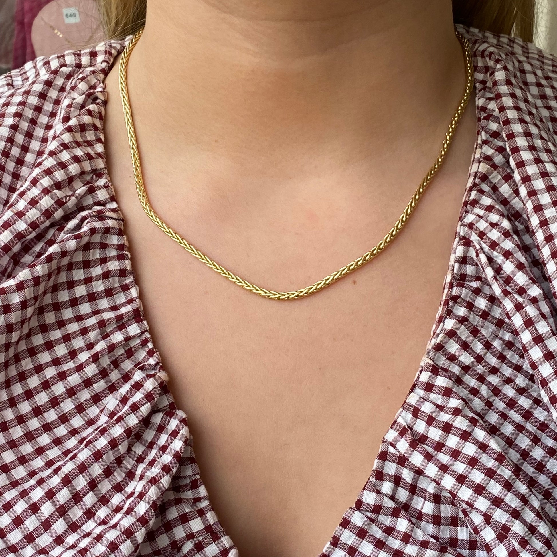 9ct gold Palmier necklace by Mark Milton featuring a detailed palm leaf pendant on a sleek chain.